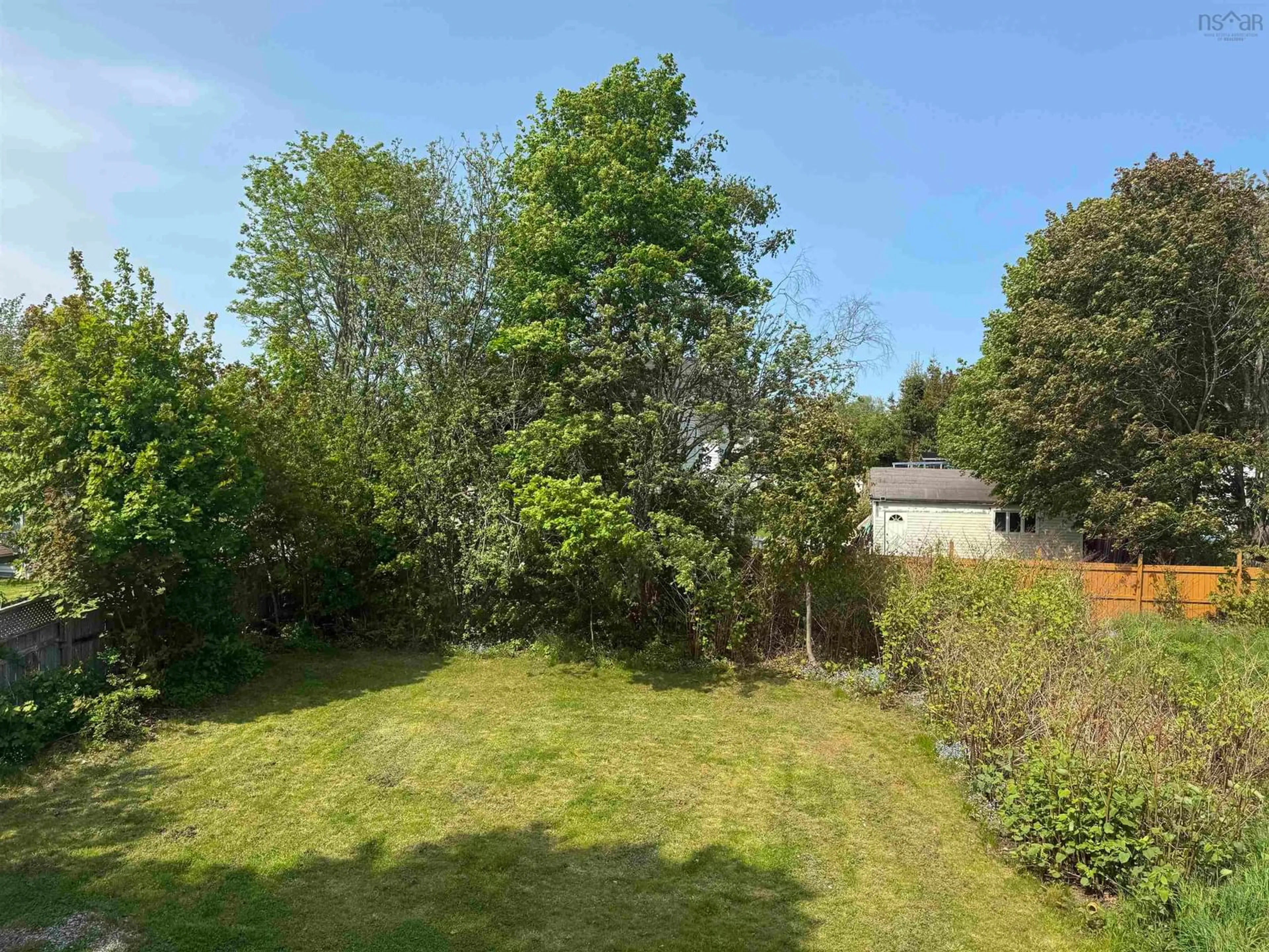 A pic from outside/outdoor area/front of a property/back of a property/a pic from drone, forest/trees view for 101 Peppett St, North Sydney Nova Scotia B2A 2N9