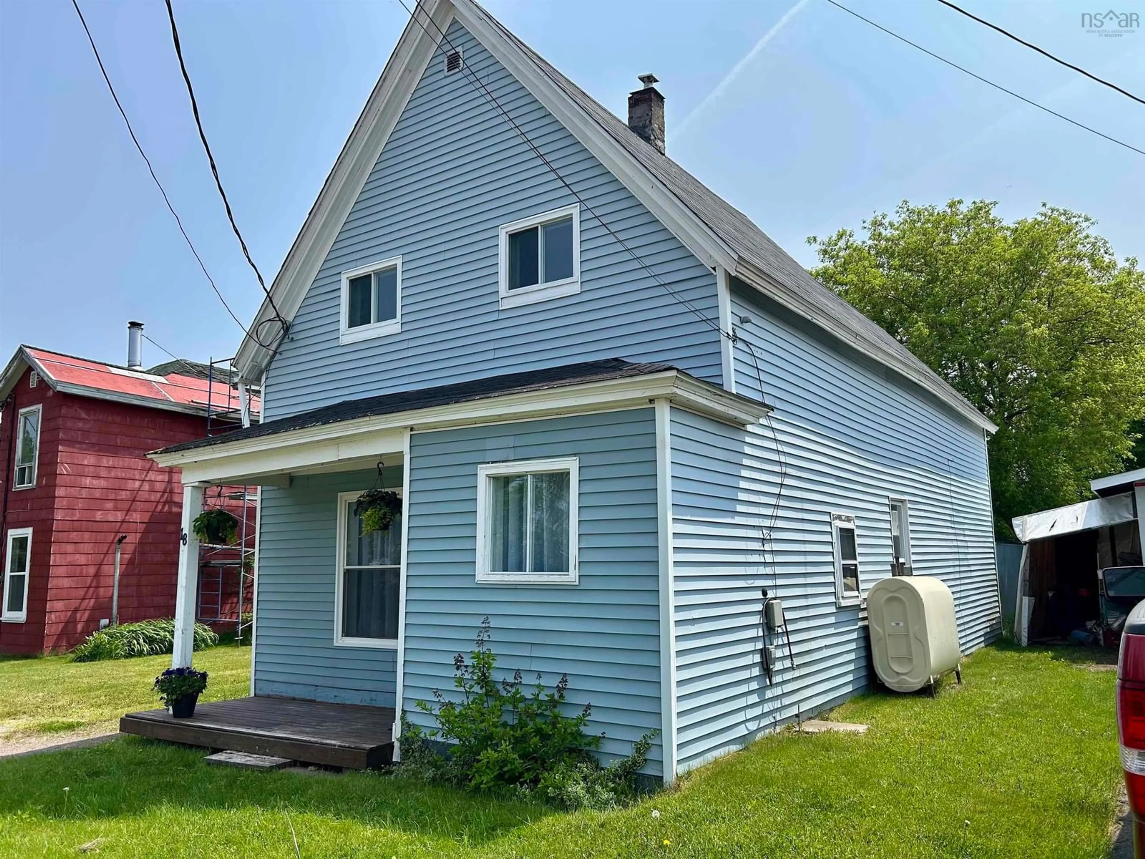 Home with vinyl exterior material, street for 18 Mill Ave, Amherst Nova Scotia B4H 1E1