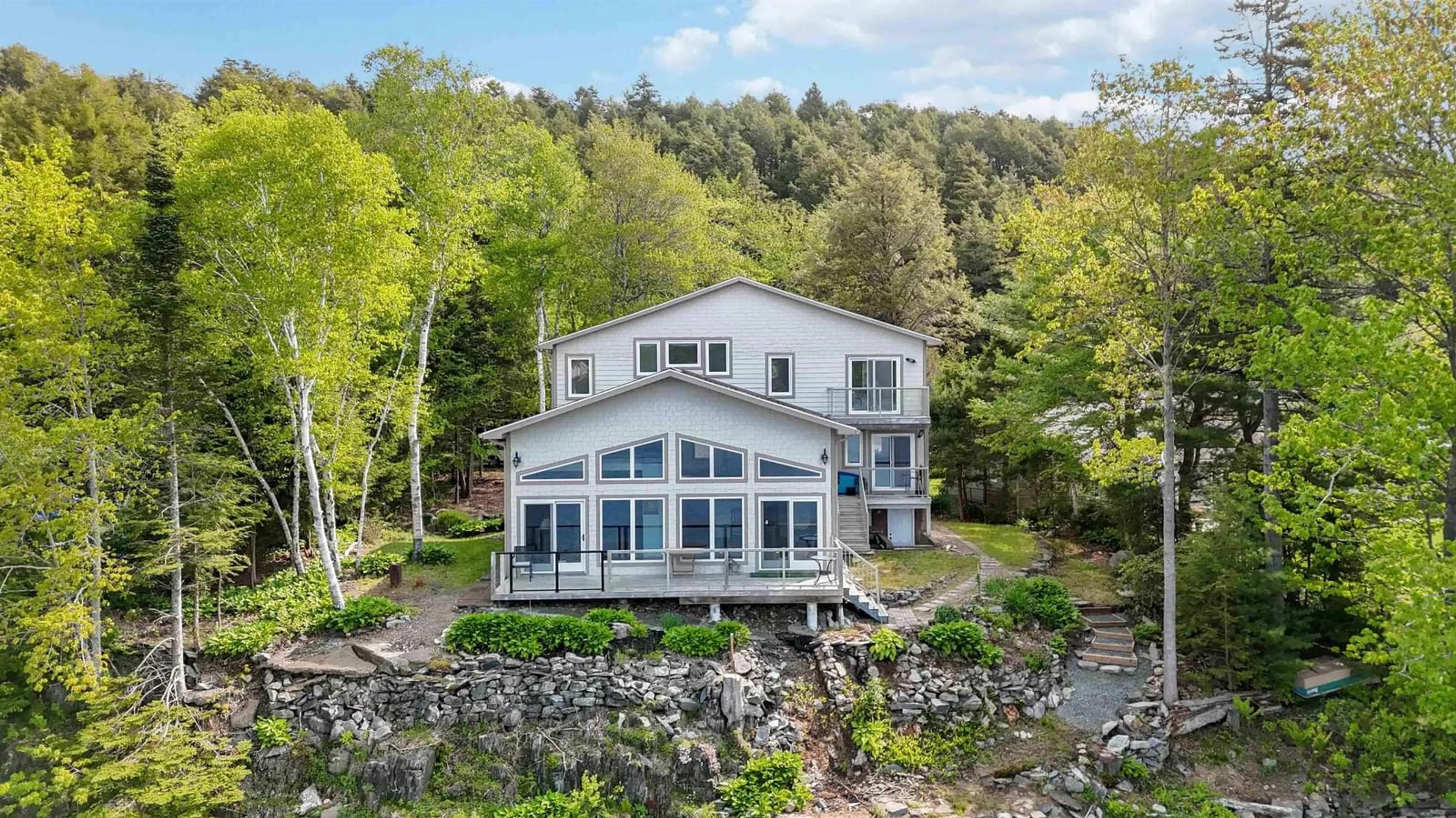 A pic from outside/outdoor area/front of a property/back of a property/a pic from drone, water/lake/river/ocean view for 117 River Dr, Lake Echo Nova Scotia B3E 1C8
