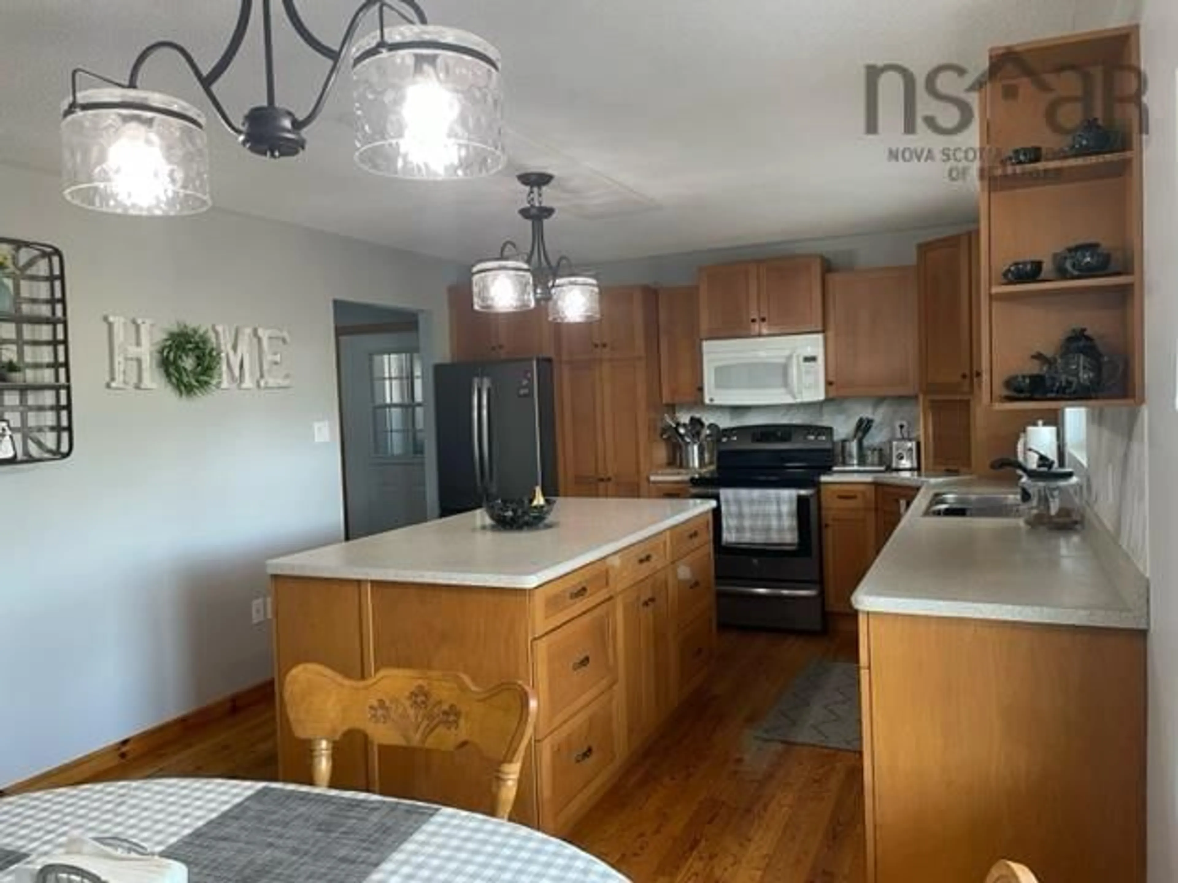 Open concept kitchen, wood/laminate floor for 9164 Highway 103, Beaverdam Lake Nova Scotia B0T 1W0