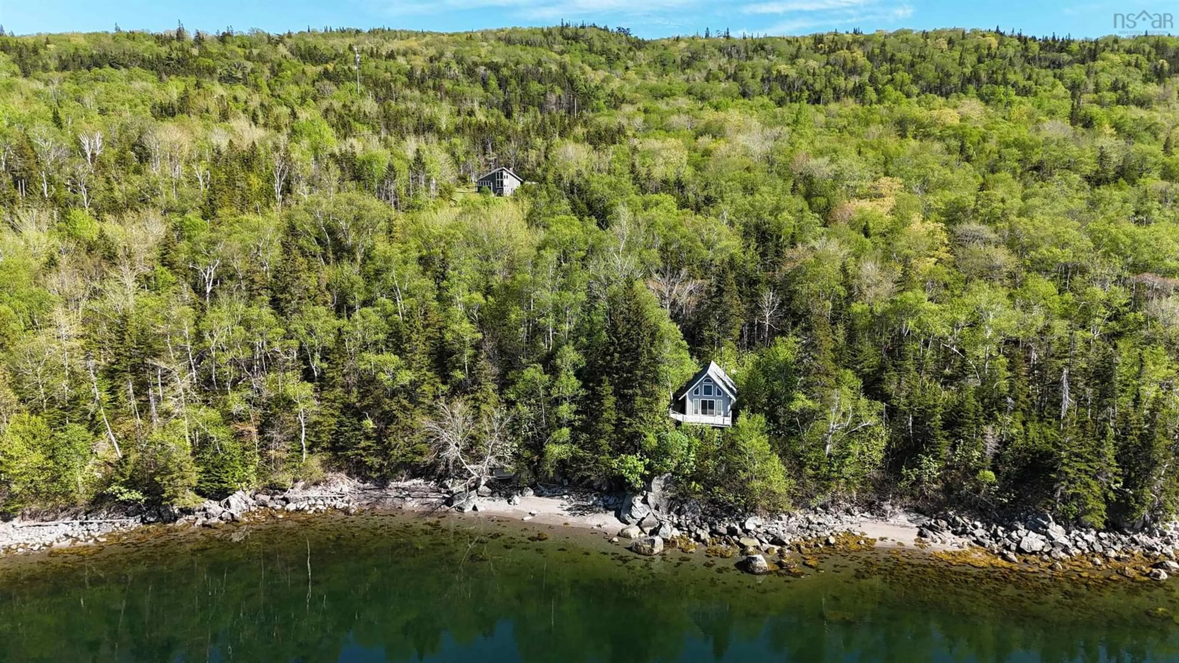 A pic from outside/outdoor area/front of a property/back of a property/a pic from drone, water/lake/river/ocean view for 55 312 Hwy, Englishtown Nova Scotia B0C 1H0