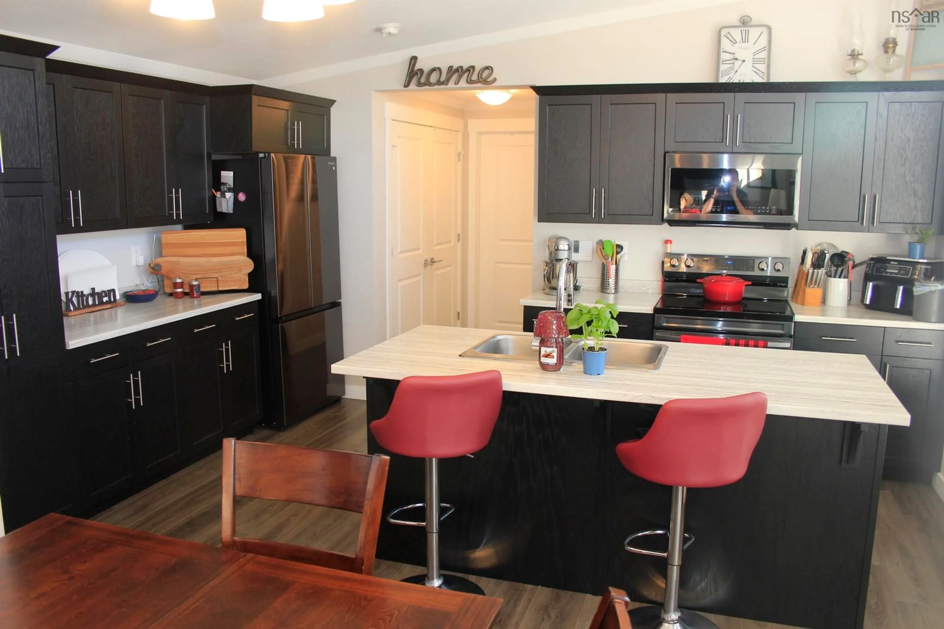 Open concept kitchen, wood/laminate floor for 66 Sunrise Crt, Upper Onslow Nova Scotia B6L 0E9