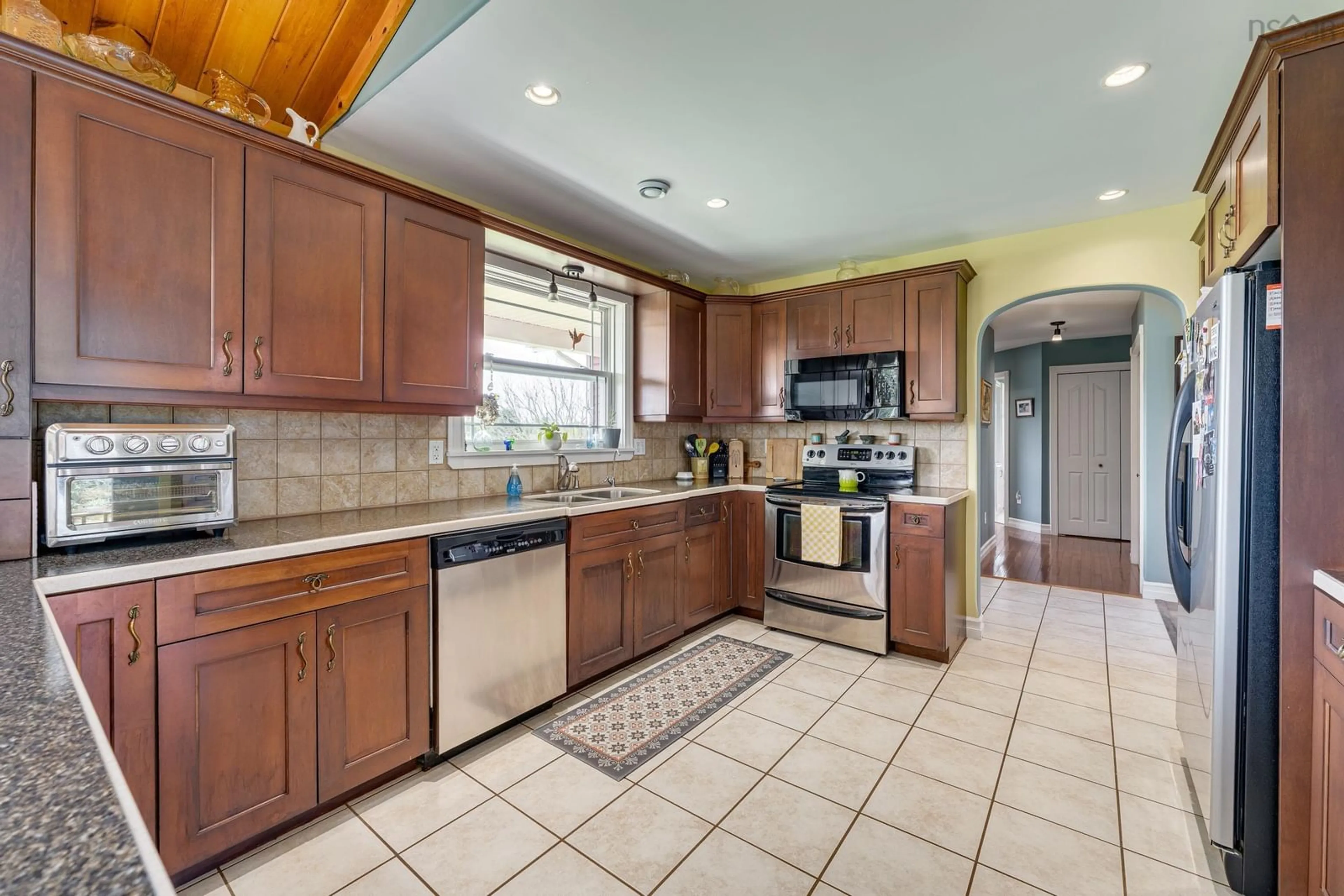 Open concept kitchen, ceramic/tile floor for 985 Main Shore Rd, North Chegoggin Nova Scotia B5A 5H2