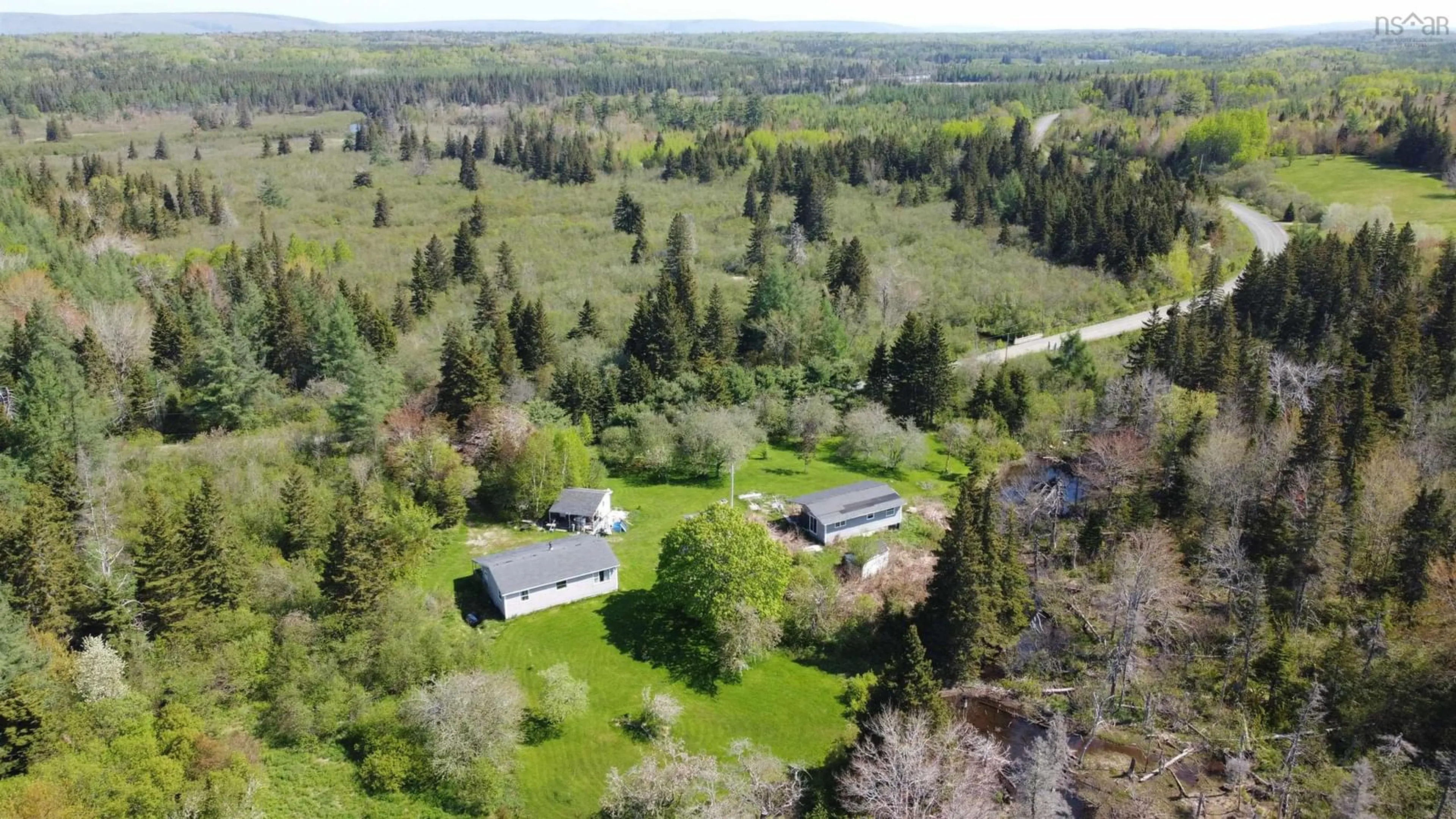 A pic from outside/outdoor area/front of a property/back of a property/a pic from drone, forest/trees view for 1746 South Side River Denys Rd, South Side River Denys Nova Scotia B0E 2Y0