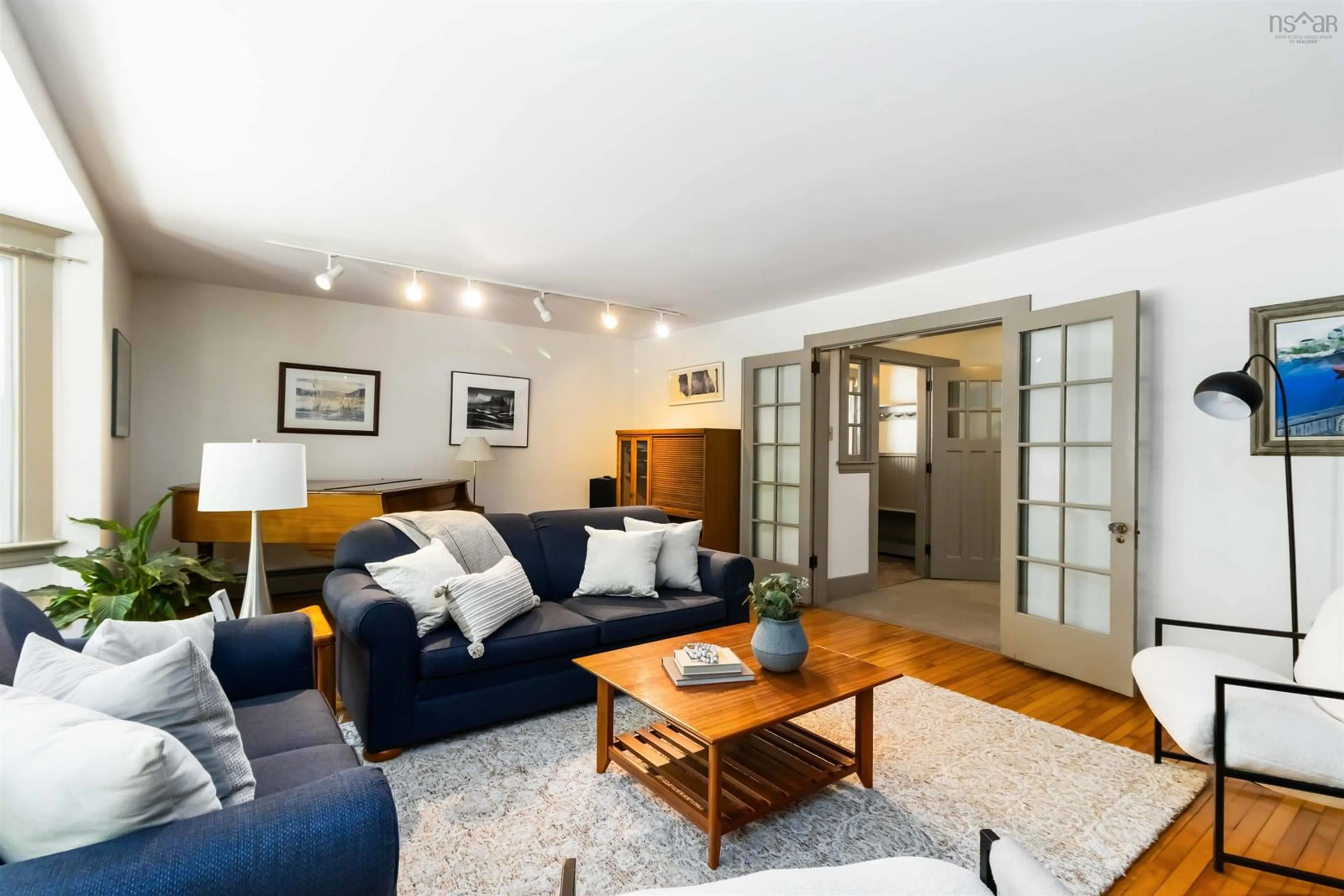 Living room with furniture, wood/laminate floor for 1537 Henry St, Halifax Nova Scotia B3H 3K1