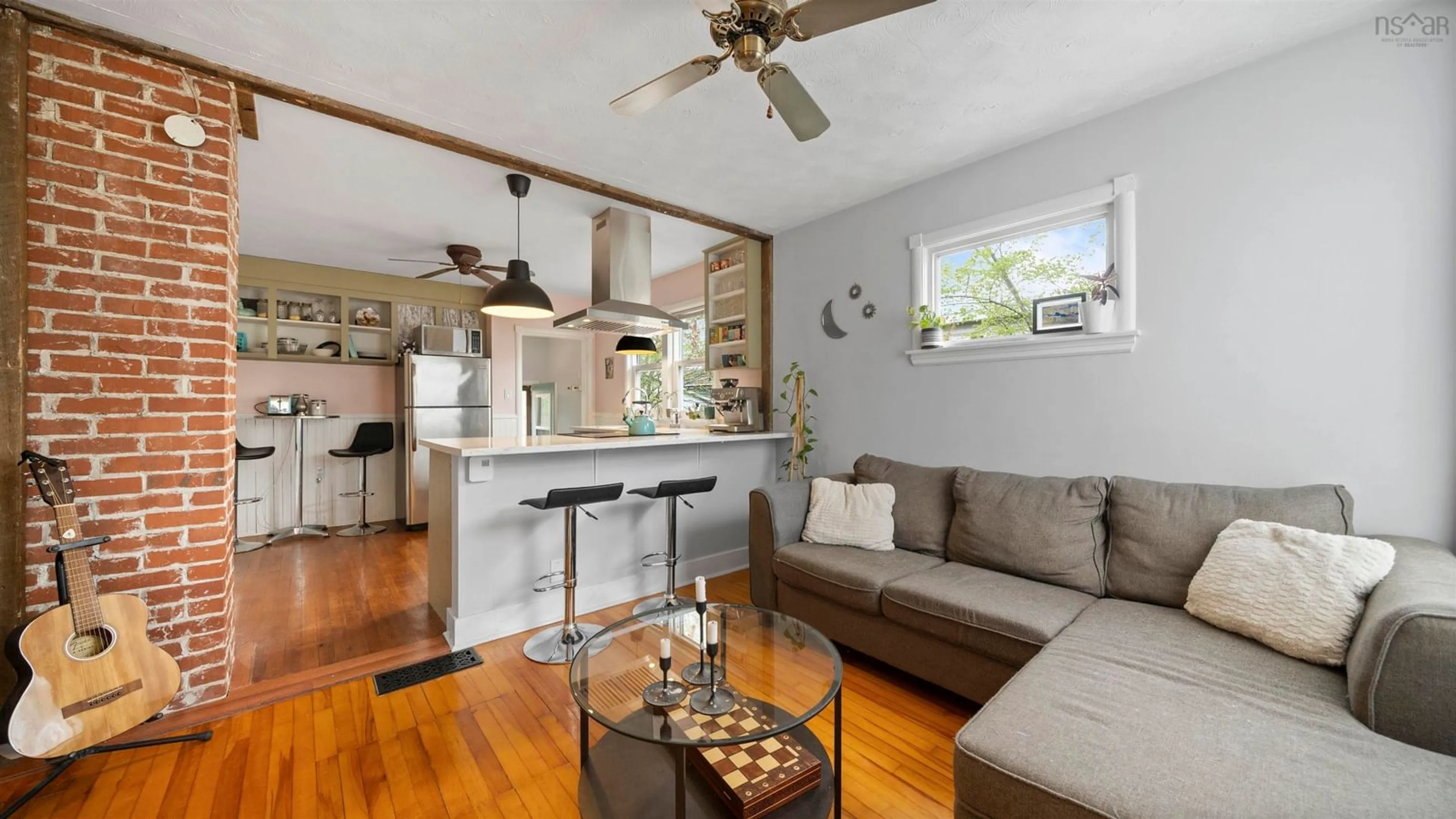 Living room with furniture, wood/laminate floor for 63 Rufus Ave, Fairview Nova Scotia B3N 2L6