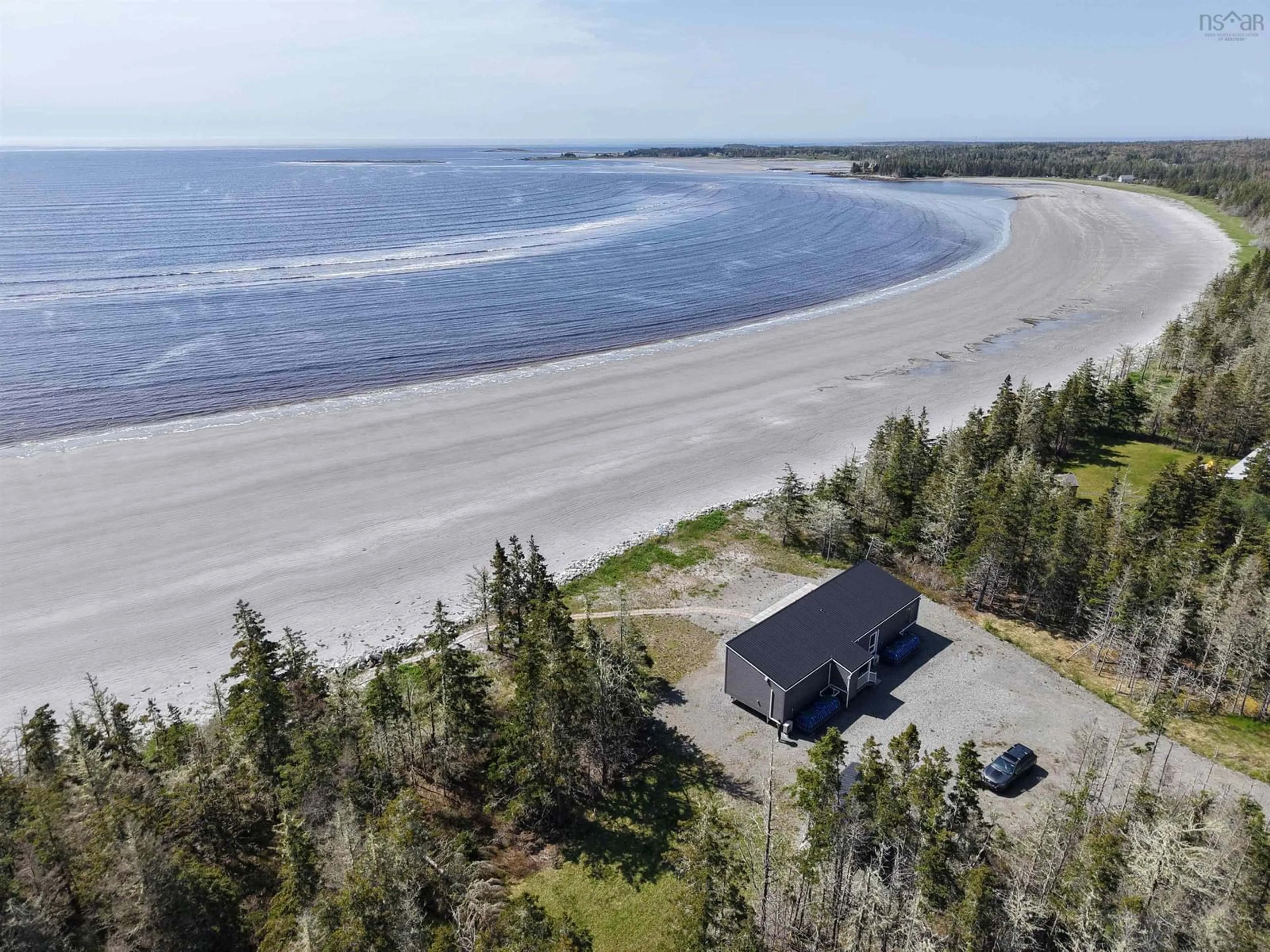 A pic from outside/outdoor area/front of a property/back of a property/a pic from drone, water/lake/river/ocean view for 70 Seaside Dr, Louis Head Nova Scotia B0T 1W0