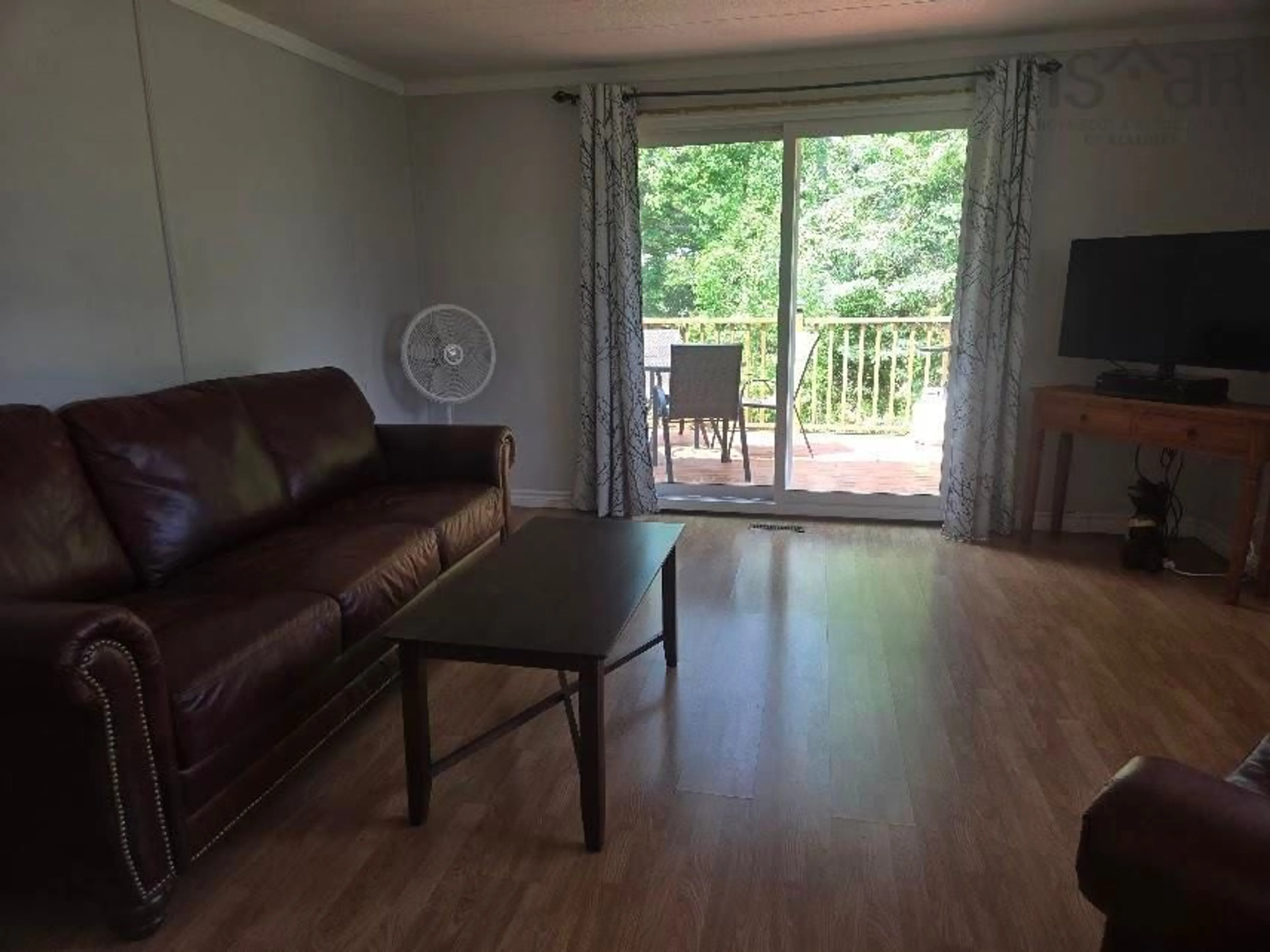 Living room with furniture, wood/laminate floor for 116 Loop 6 Hwy, Bayhead Nova Scotia B0K 1V0
