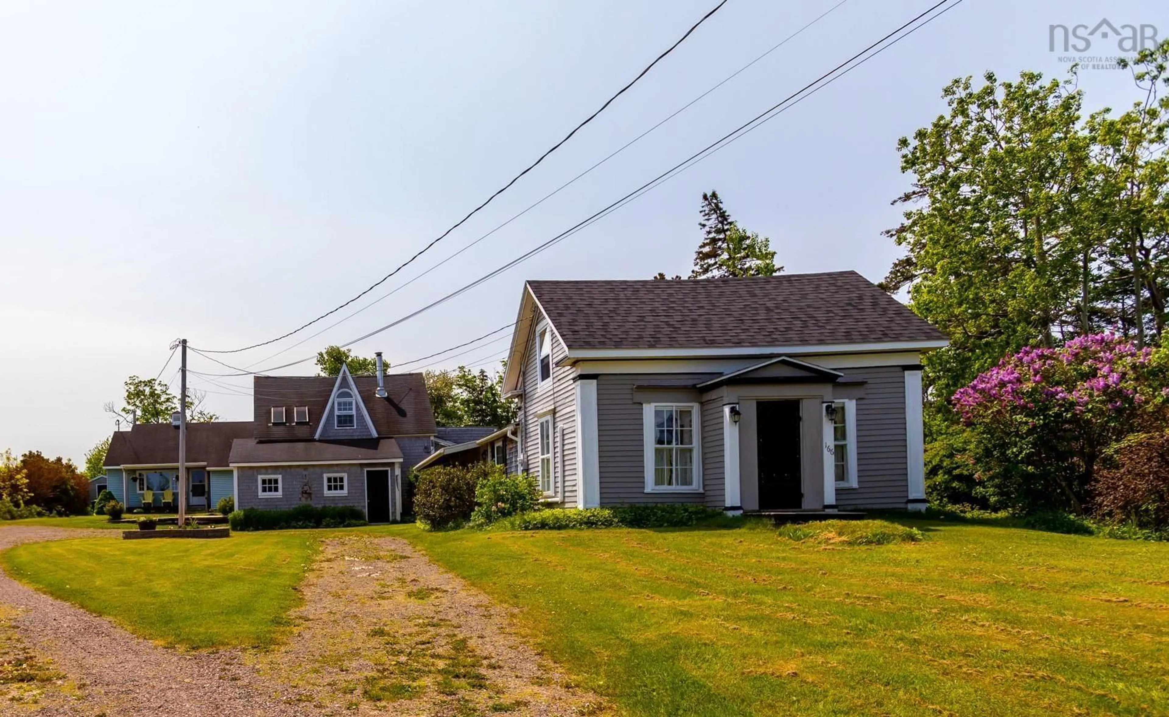 A pic from outside/outdoor area/front of a property/back of a property/a pic from drone, street for 166-168 Seaman St, Margaretsville Nova Scotia B0S 1N0