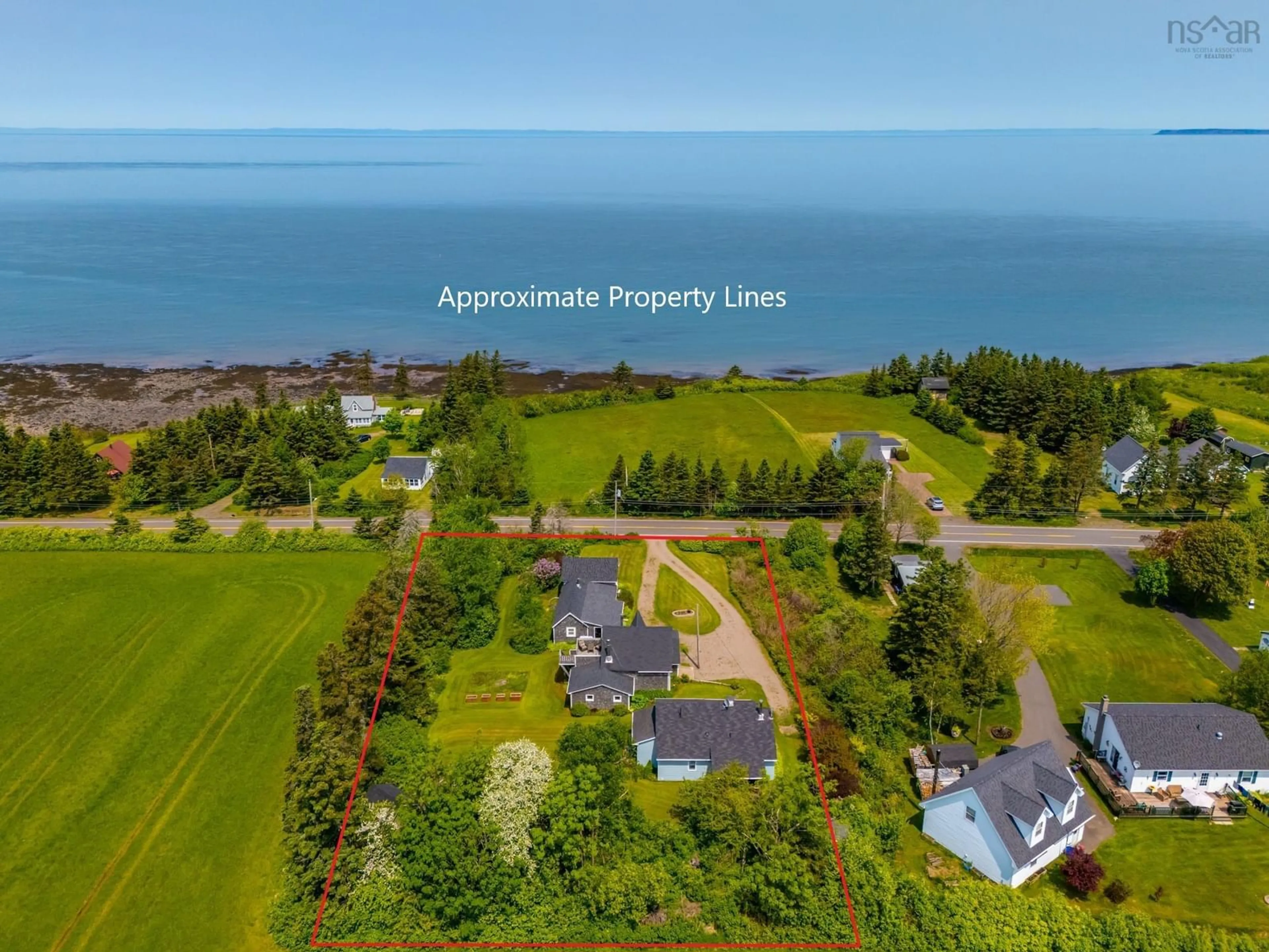 A pic from outside/outdoor area/front of a property/back of a property/a pic from drone, water/lake/river/ocean view for 166-168 Seaman St, Margaretsville Nova Scotia B0S 1N0