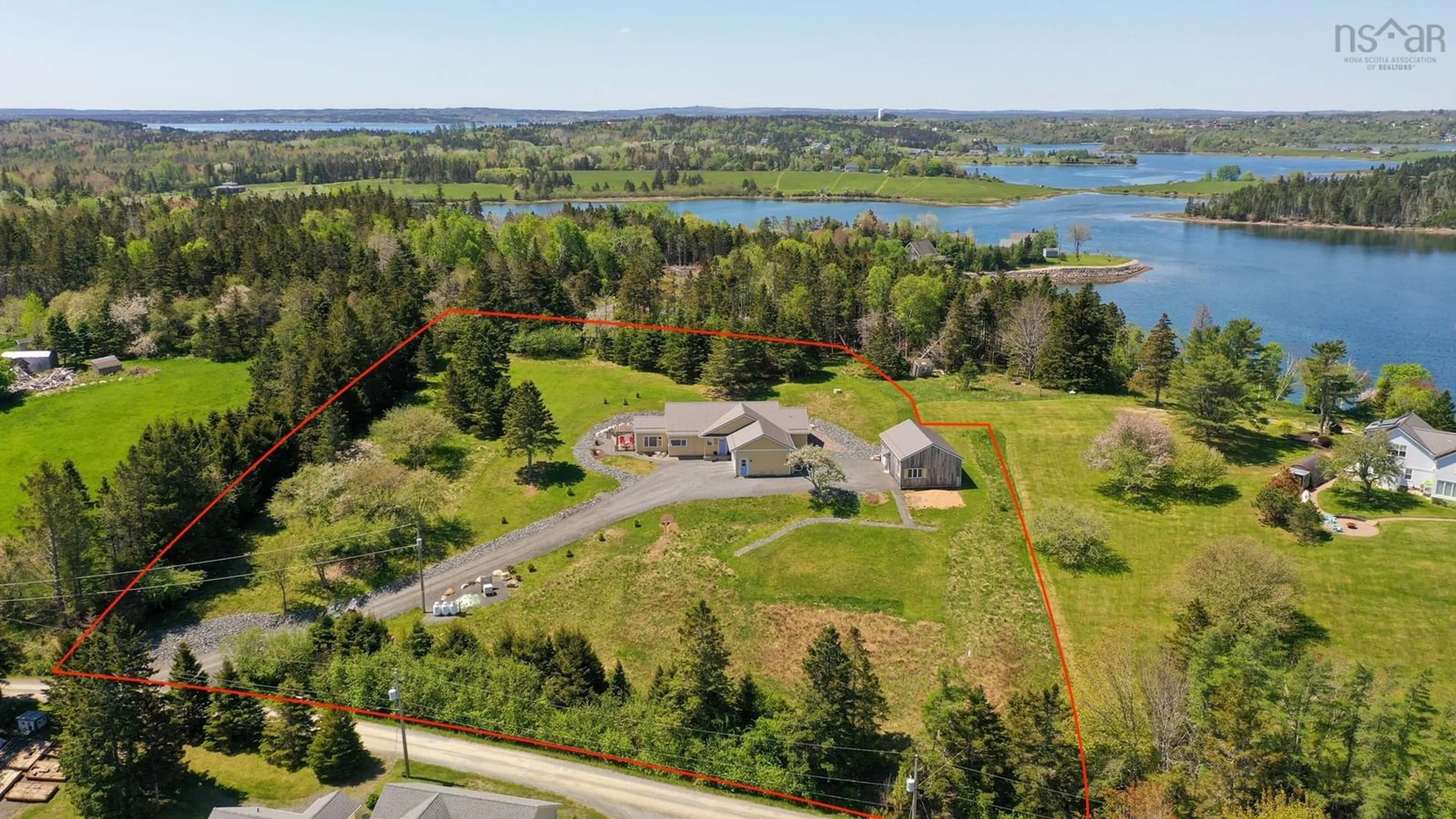A pic from outside/outdoor area/front of a property/back of a property/a pic from drone, water/lake/river/ocean view for 207 Hebb Point Rd, Heckmans Island Nova Scotia B0J 2C0