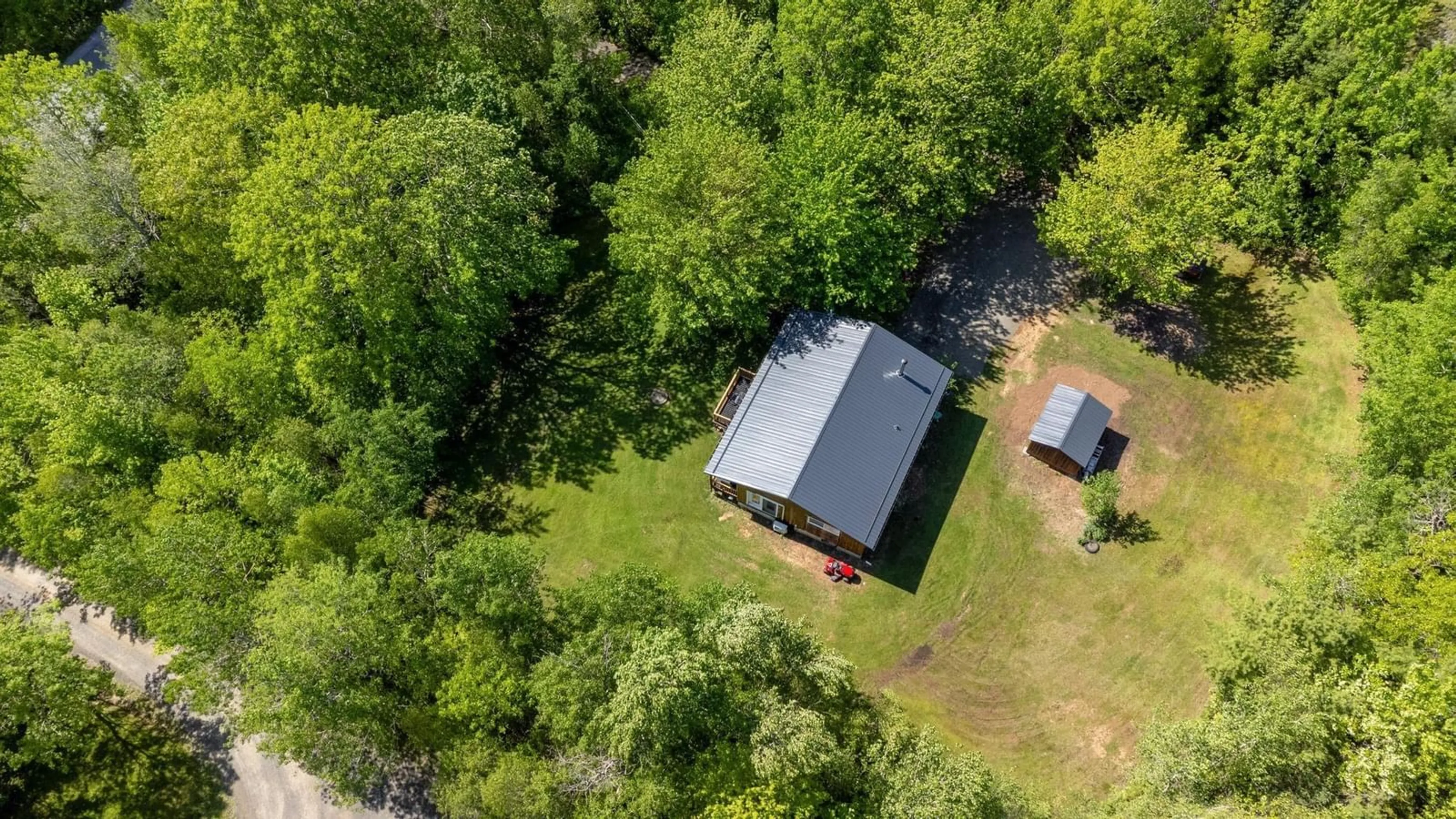A pic from outside/outdoor area/front of a property/back of a property/a pic from drone, forest/trees view for 238 Trout Lake Road, West Inglisville Nova Scotia B0S 1M0