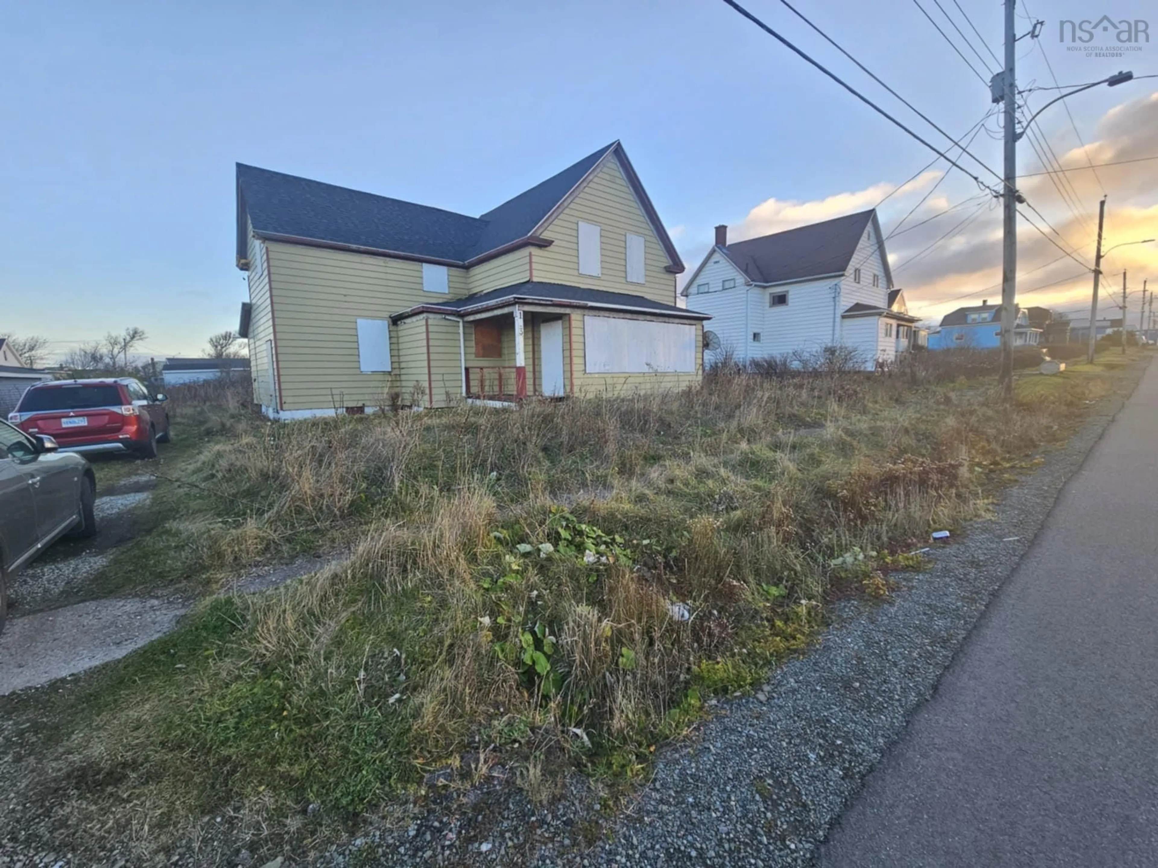 A pic from outside/outdoor area/front of a property/back of a property/a pic from drone, street for 103 Ocean Ave, Glace Bay Nova Scotia B1A 3V5