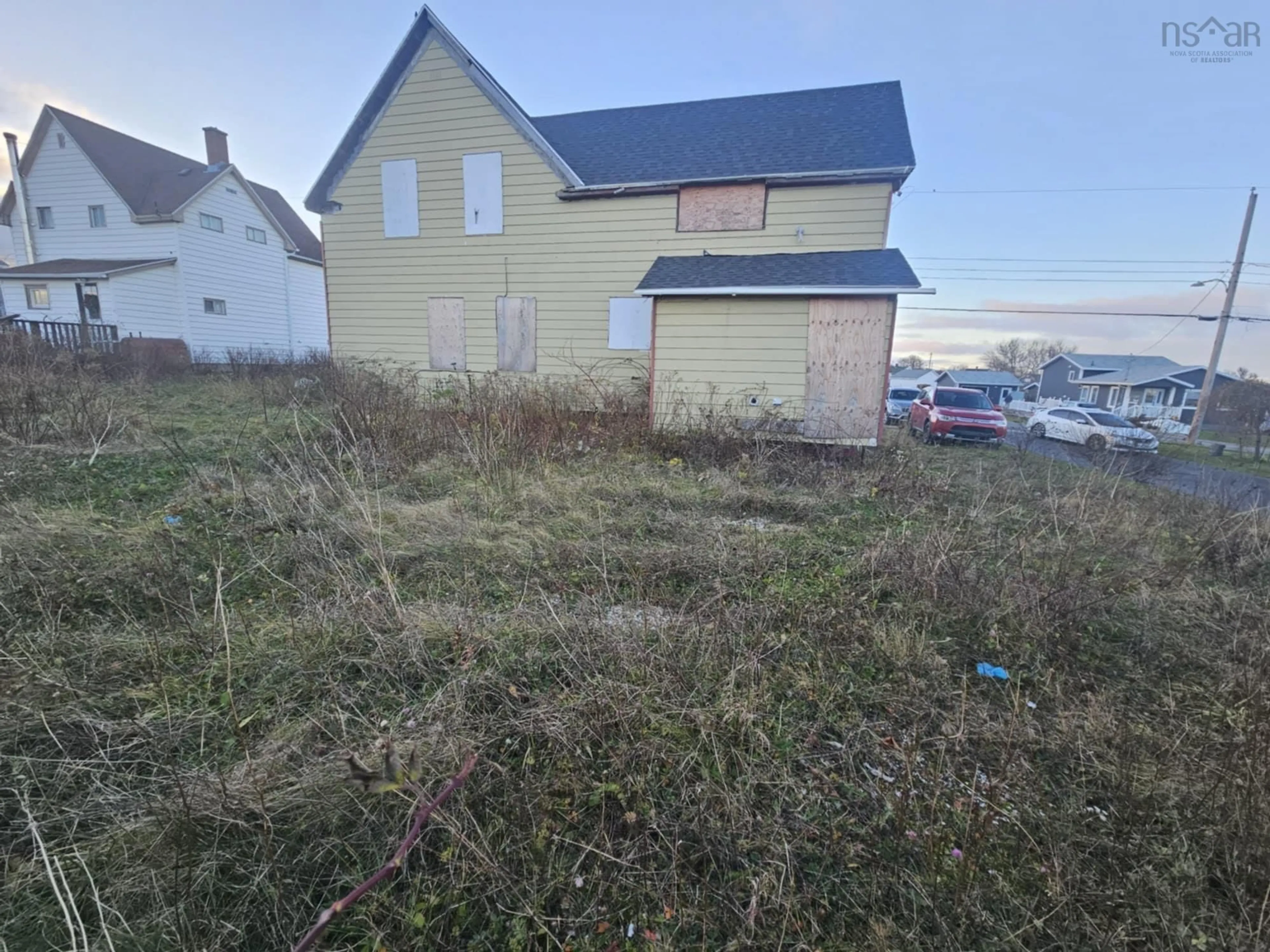 A pic from outside/outdoor area/front of a property/back of a property/a pic from drone, building for 103 Ocean Ave, Glace Bay Nova Scotia B1A 3V5