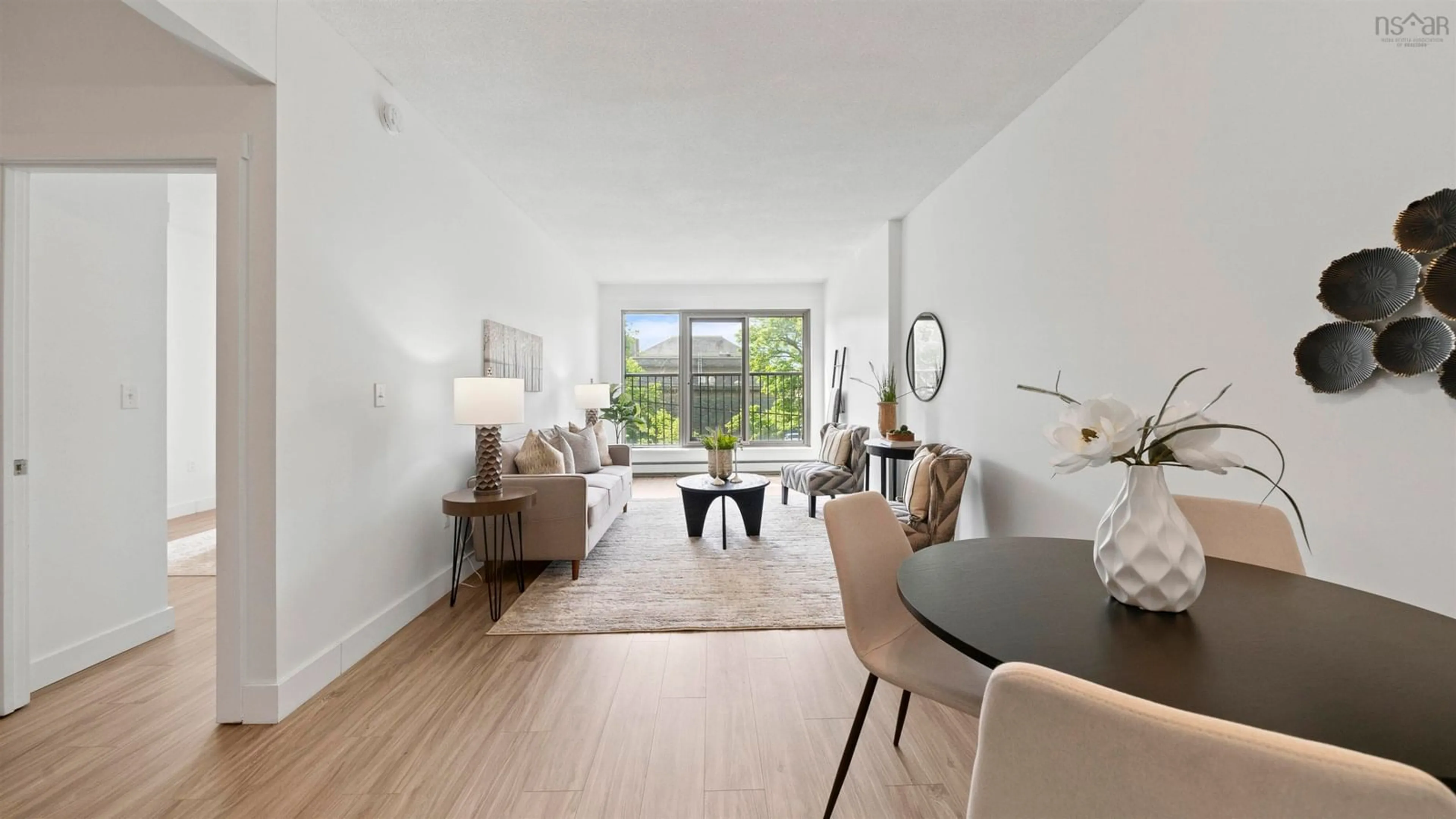 Living room with furniture, wood/laminate floor for 6369 Coburg Rd #204, Halifax Nova Scotia B3H 4J7