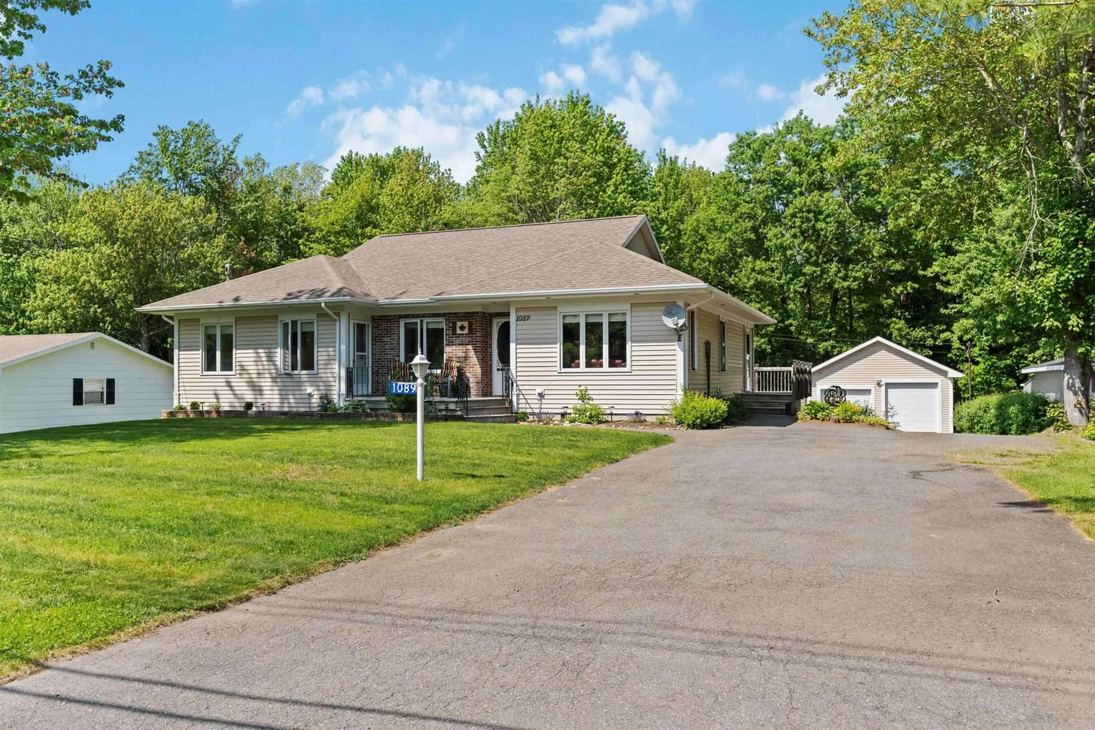 Home with vinyl exterior material, street for 1089 Pine Crest Dr, Centreville Nova Scotia B0P 1J0
