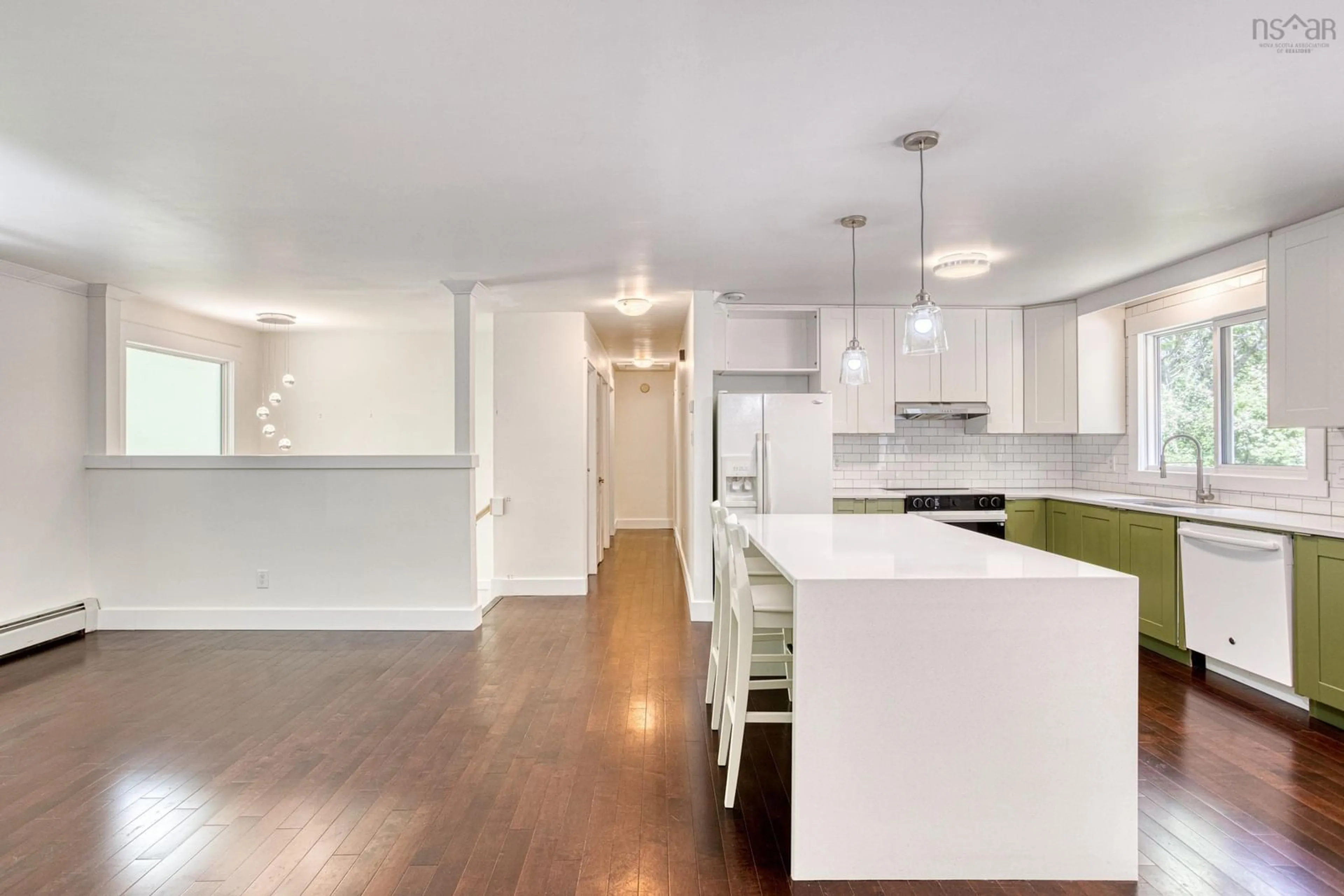 Open concept kitchen, wood/laminate floor for 65 Union St, Bedford Nova Scotia B4A 2B6