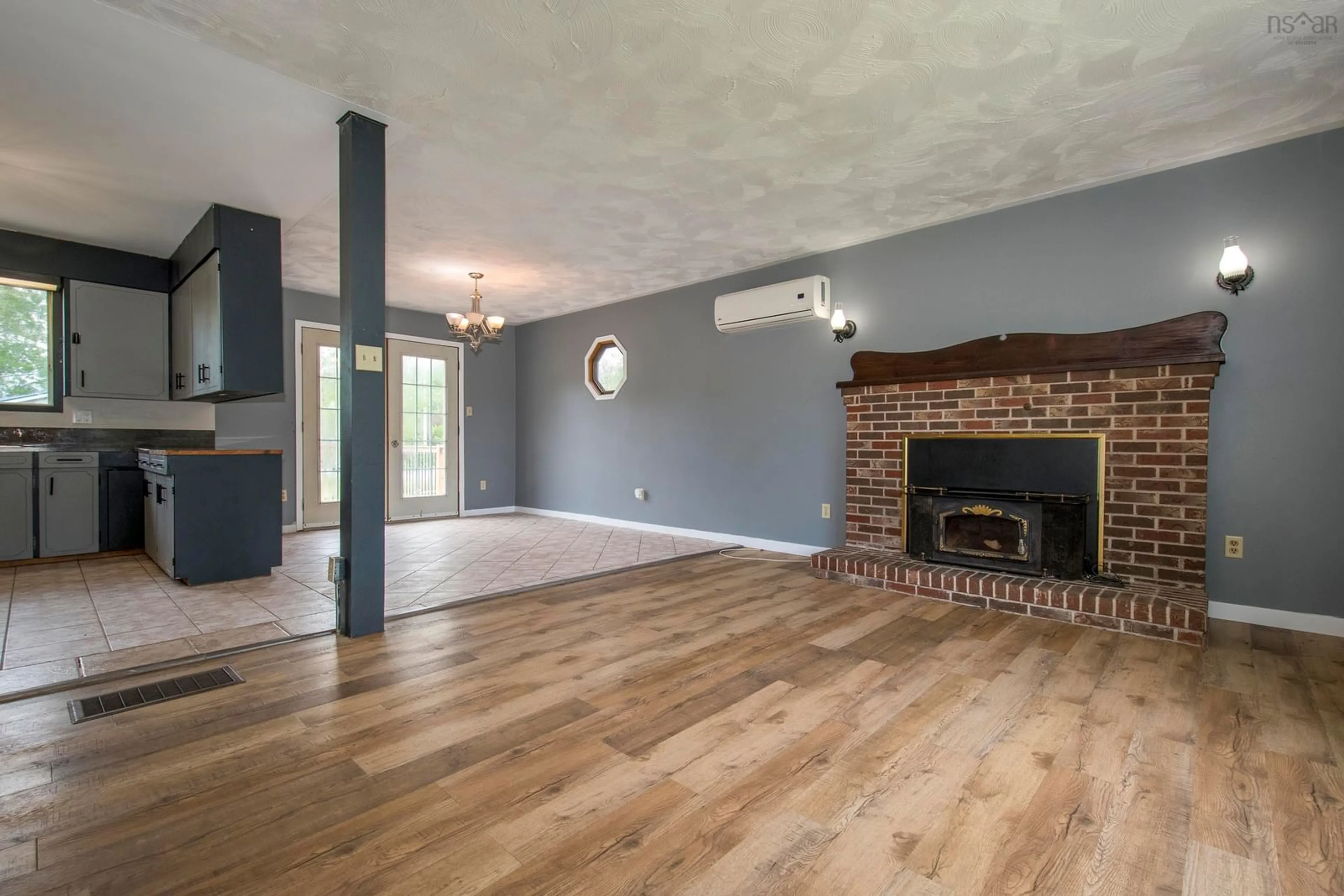 Living room with furniture, wood/laminate floor for 46 Saxon St, Centreville Nova Scotia B0P 1J0