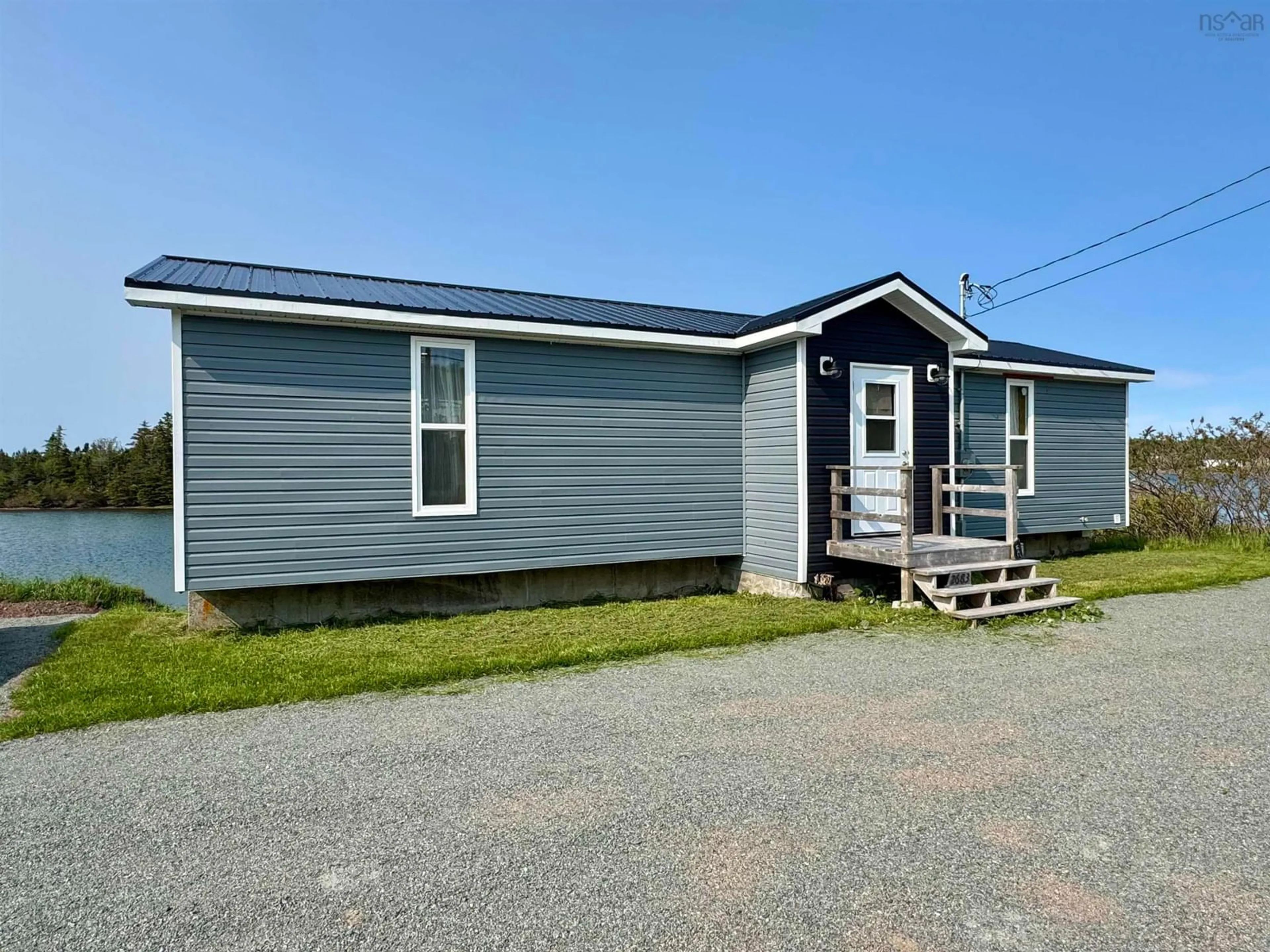 Home with vinyl exterior material, street for 2683 Highway 320, Poulamon Nova Scotia B0E 1K0