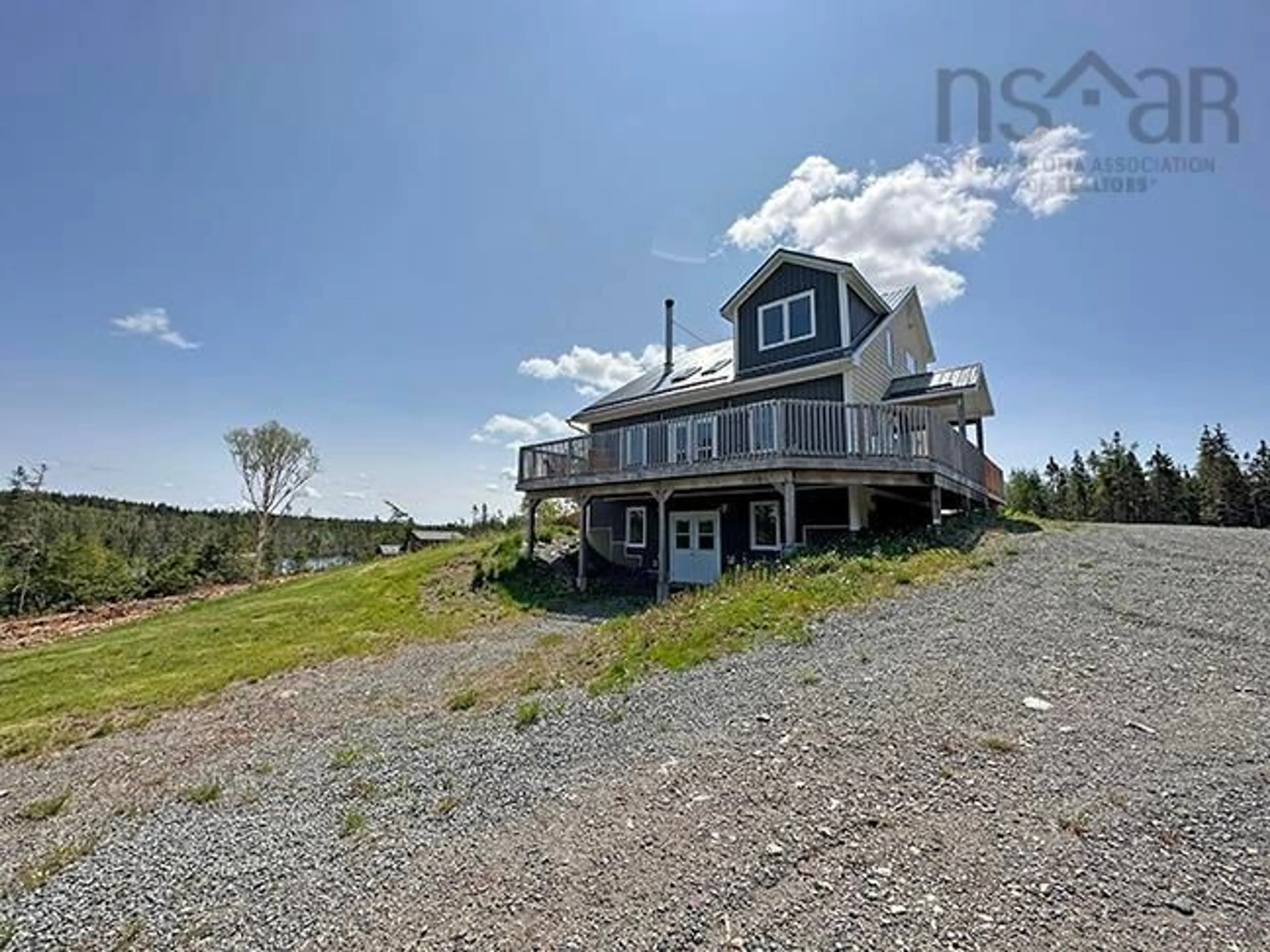 A pic from outside/outdoor area/front of a property/back of a property/a pic from drone, water/lake/river/ocean view for 1587 Corbetts Cove Rd #Lot 1B, Barra Head Nova Scotia B0E 3B0
