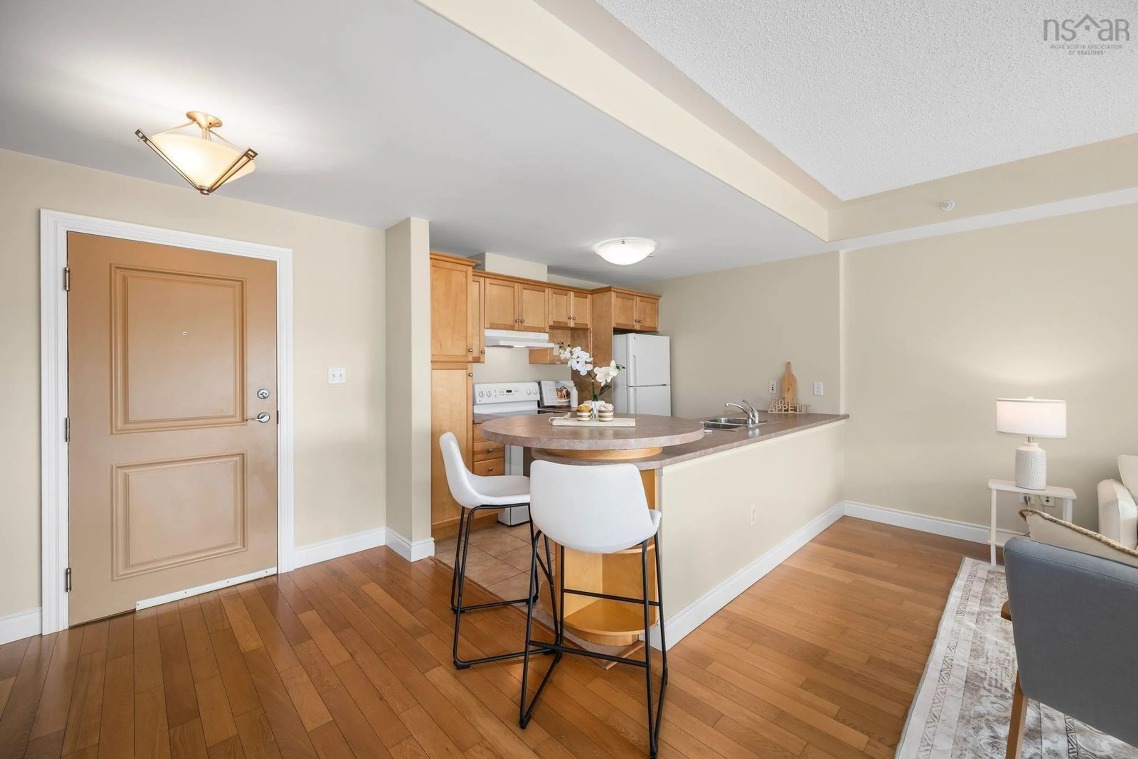 Open concept kitchen, wood/laminate floor for 647 Bedford Hwy #305, Halifax Nova Scotia B3M 0A5