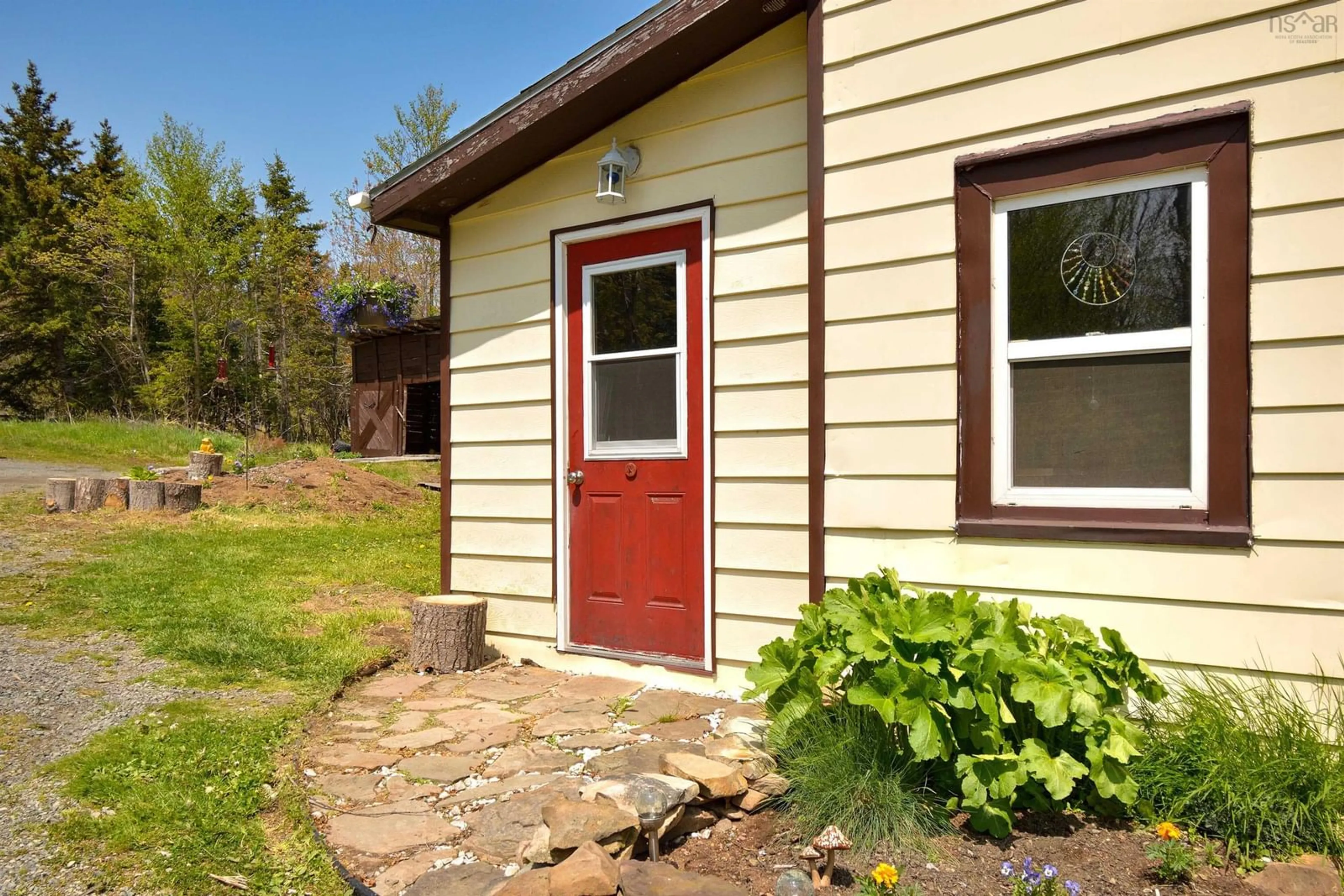 Home with vinyl exterior material, street for 8982 Pepperell St, St. Peter's Nova Scotia B0E 3B0
