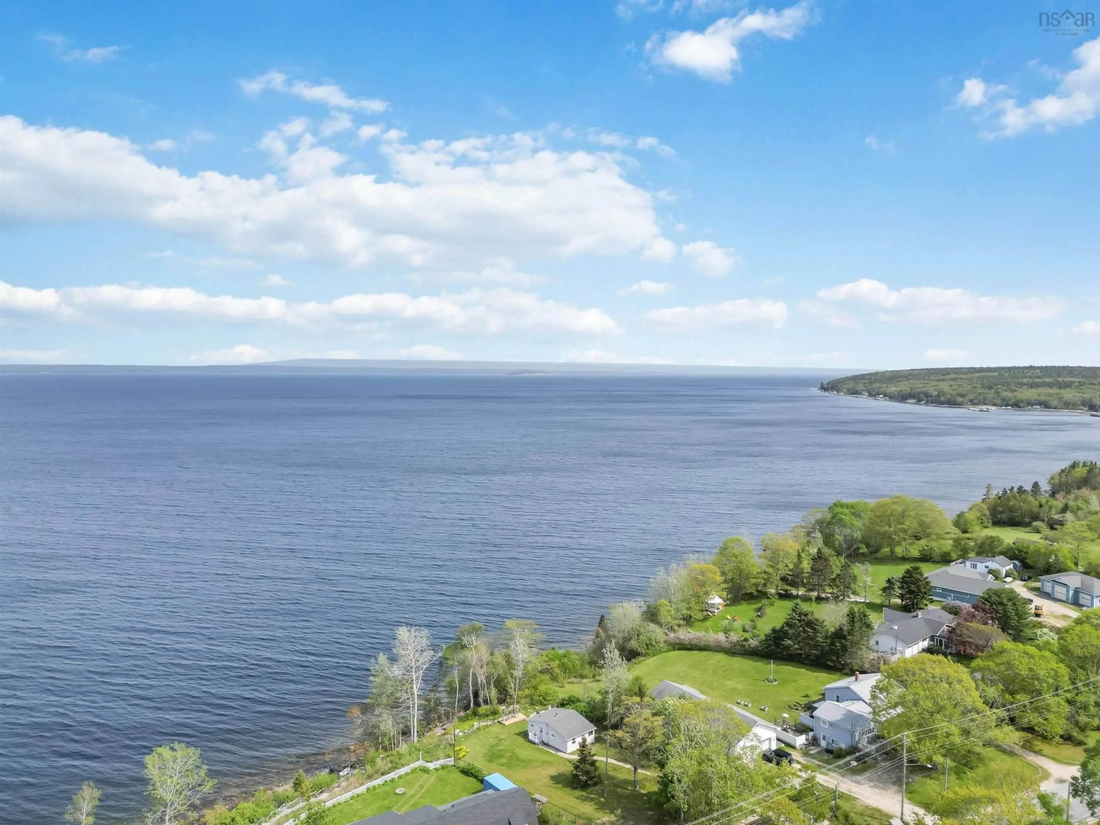 A pic from outside/outdoor area/front of a property/back of a property/a pic from drone, water/lake/river/ocean view for 1027 Highway 329, Mill Cove Nova Scotia B0J 1T0
