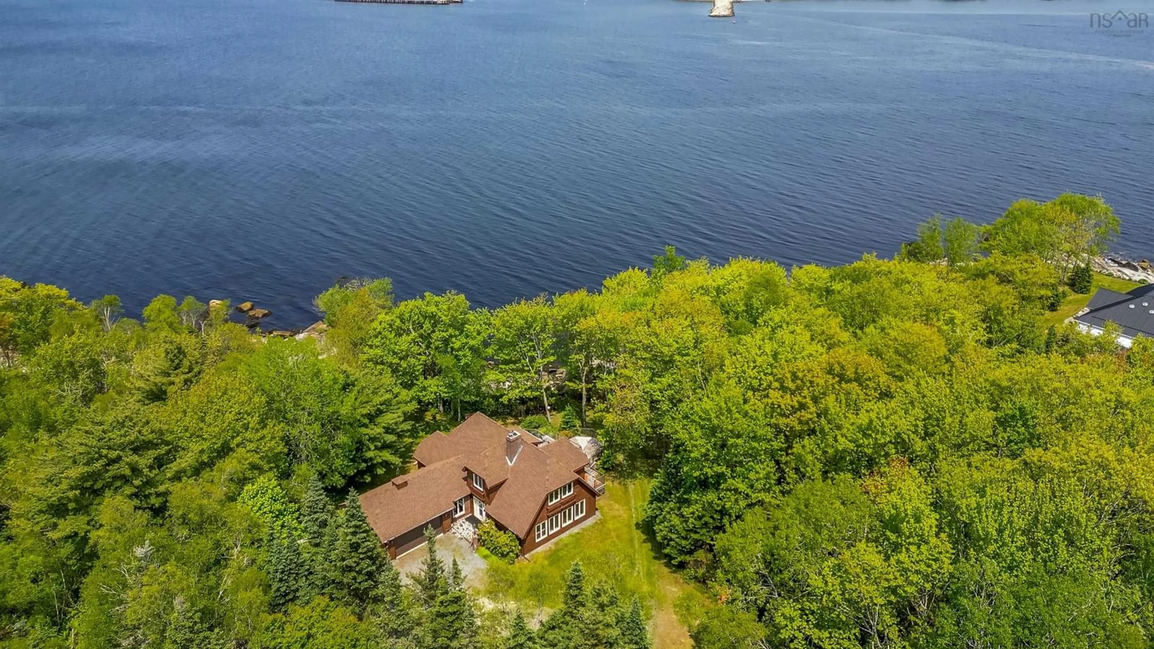 A pic from outside/outdoor area/front of a property/back of a property/a pic from drone, water/lake/river/ocean view for 65 Shore Rd, Mount Pleasant Nova Scotia B0T 1K0