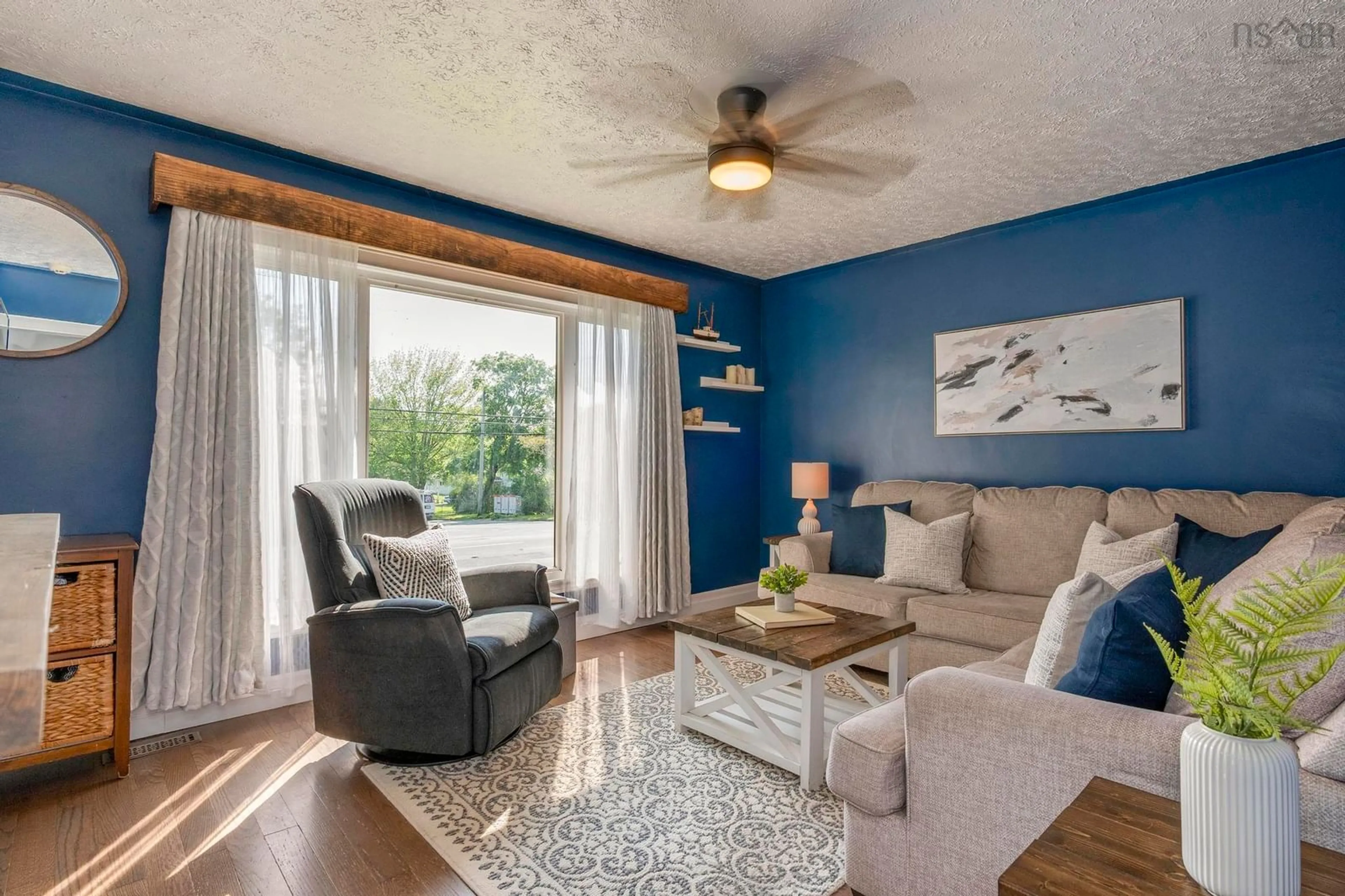 Living room with furniture, wood/laminate floor for 31 Valleyfield Rd, Dartmouth Nova Scotia B2W 1N4