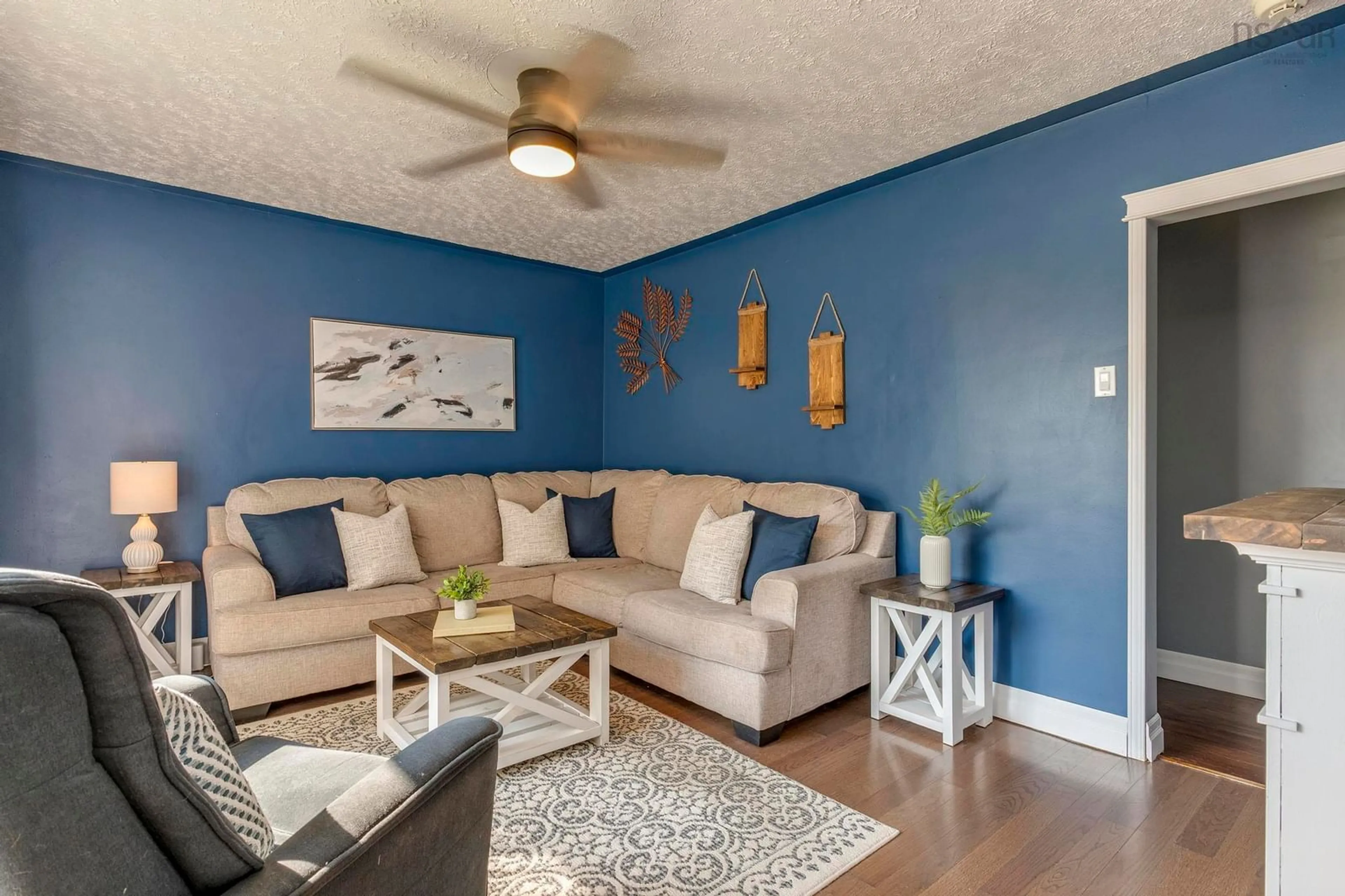 Living room with furniture, wood/laminate floor for 31 Valleyfield Rd, Dartmouth Nova Scotia B2W 1N4