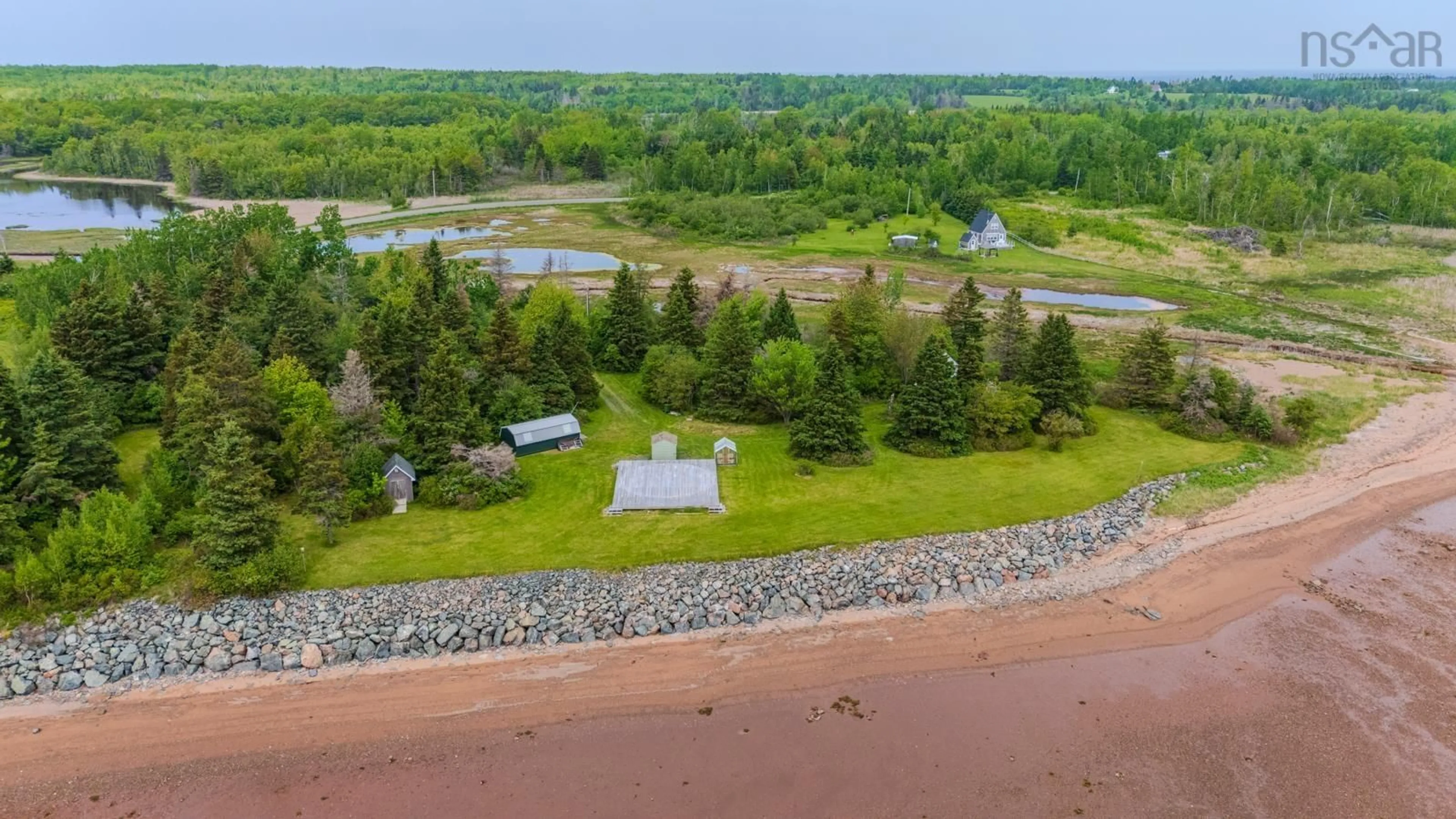 A pic from outside/outdoor area/front of a property/back of a property/a pic from drone, water/lake/river/ocean view for 4016 Malagash Rd, Malagash Point Nova Scotia B0K 1E0