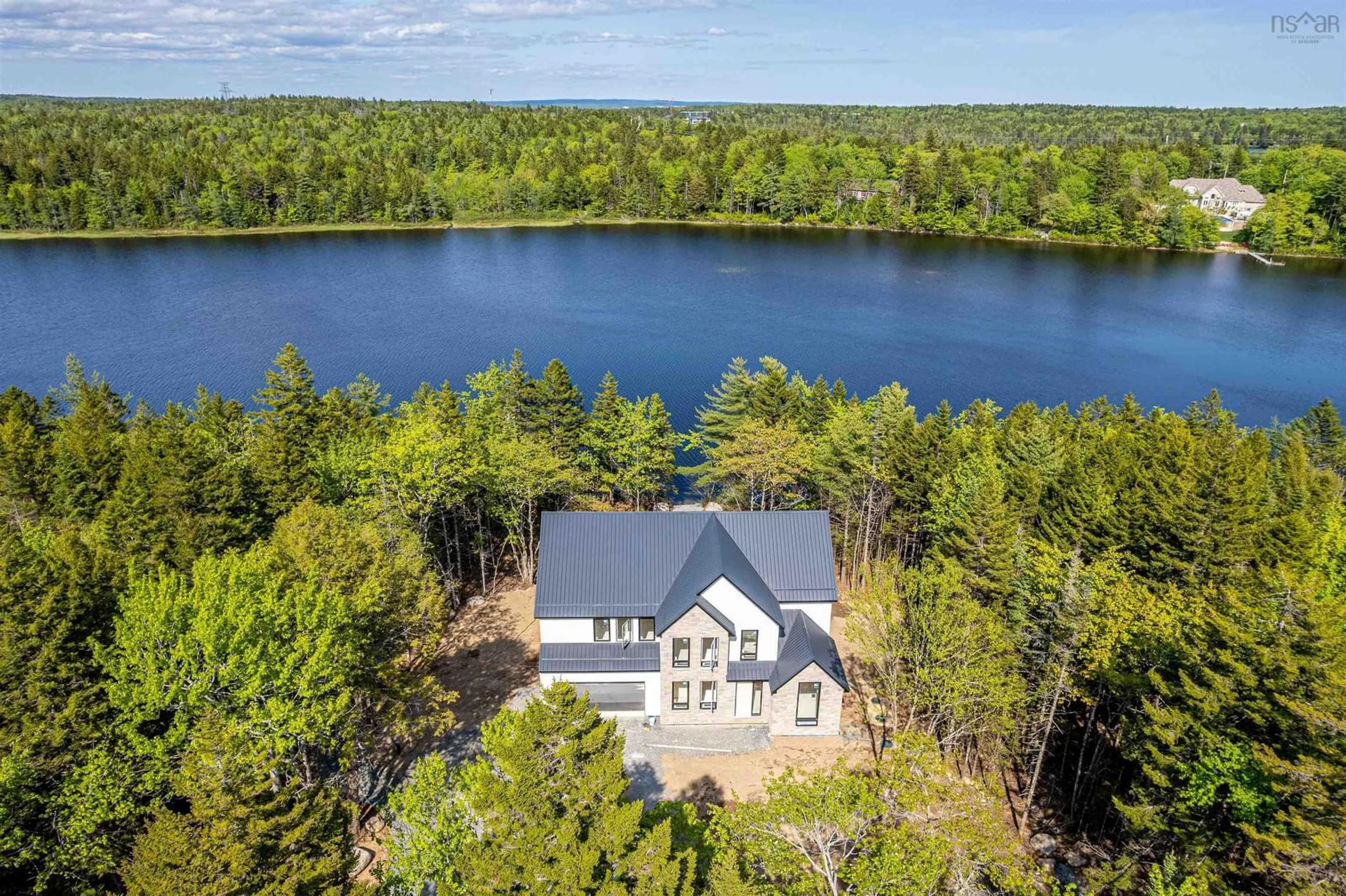 A pic from outside/outdoor area/front of a property/back of a property/a pic from drone, water/lake/river/ocean view for 103 Canoe Cres, Hammonds Plains Nova Scotia B4B 2P6