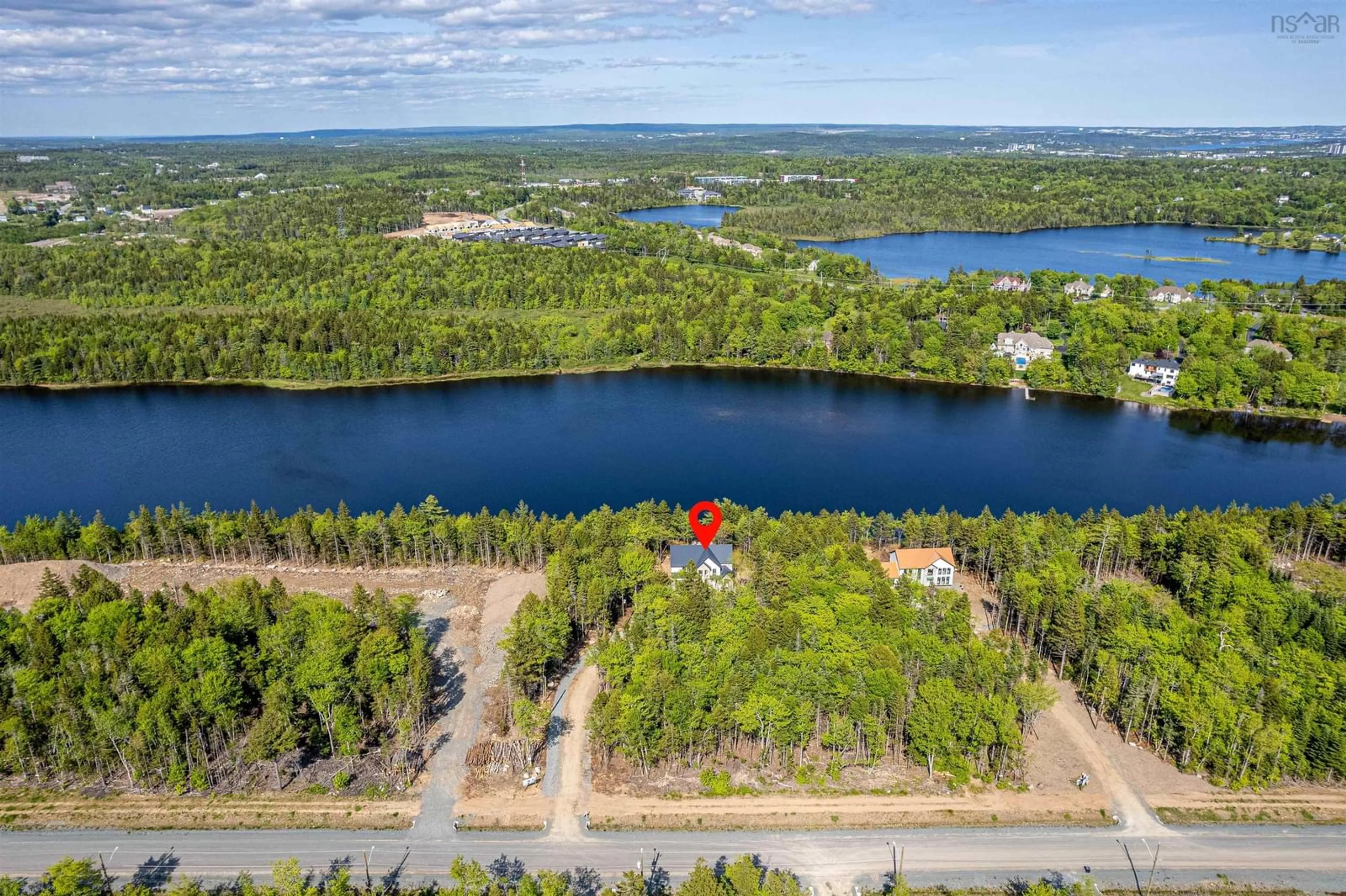 A pic from outside/outdoor area/front of a property/back of a property/a pic from drone, water/lake/river/ocean view for 103 Canoe Cres, Hammonds Plains Nova Scotia B4B 2P6