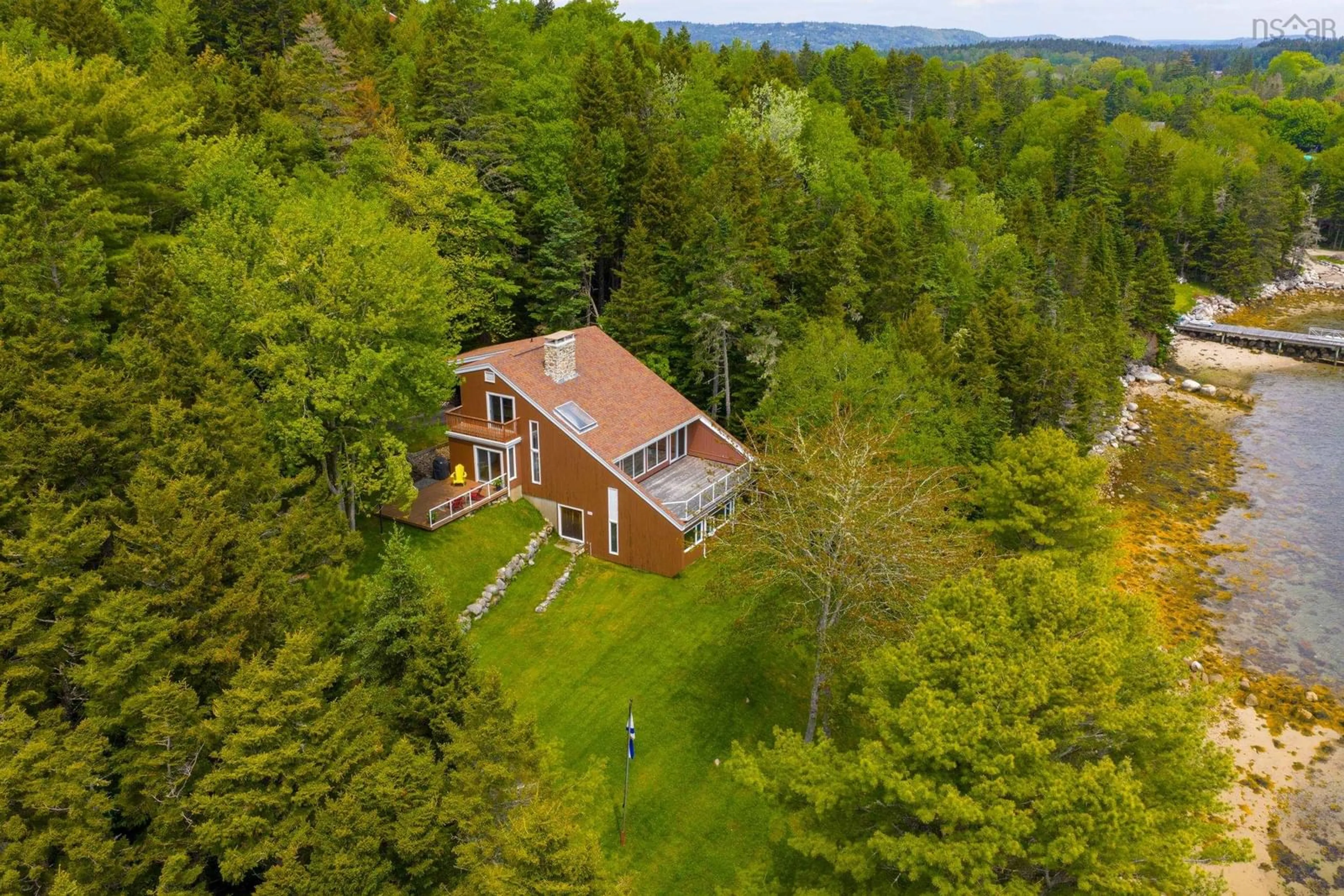 A pic from outside/outdoor area/front of a property/back of a property/a pic from drone, forest/trees view for 20 Sunnydale Dr, Glen Haven Nova Scotia B3Z 2T8
