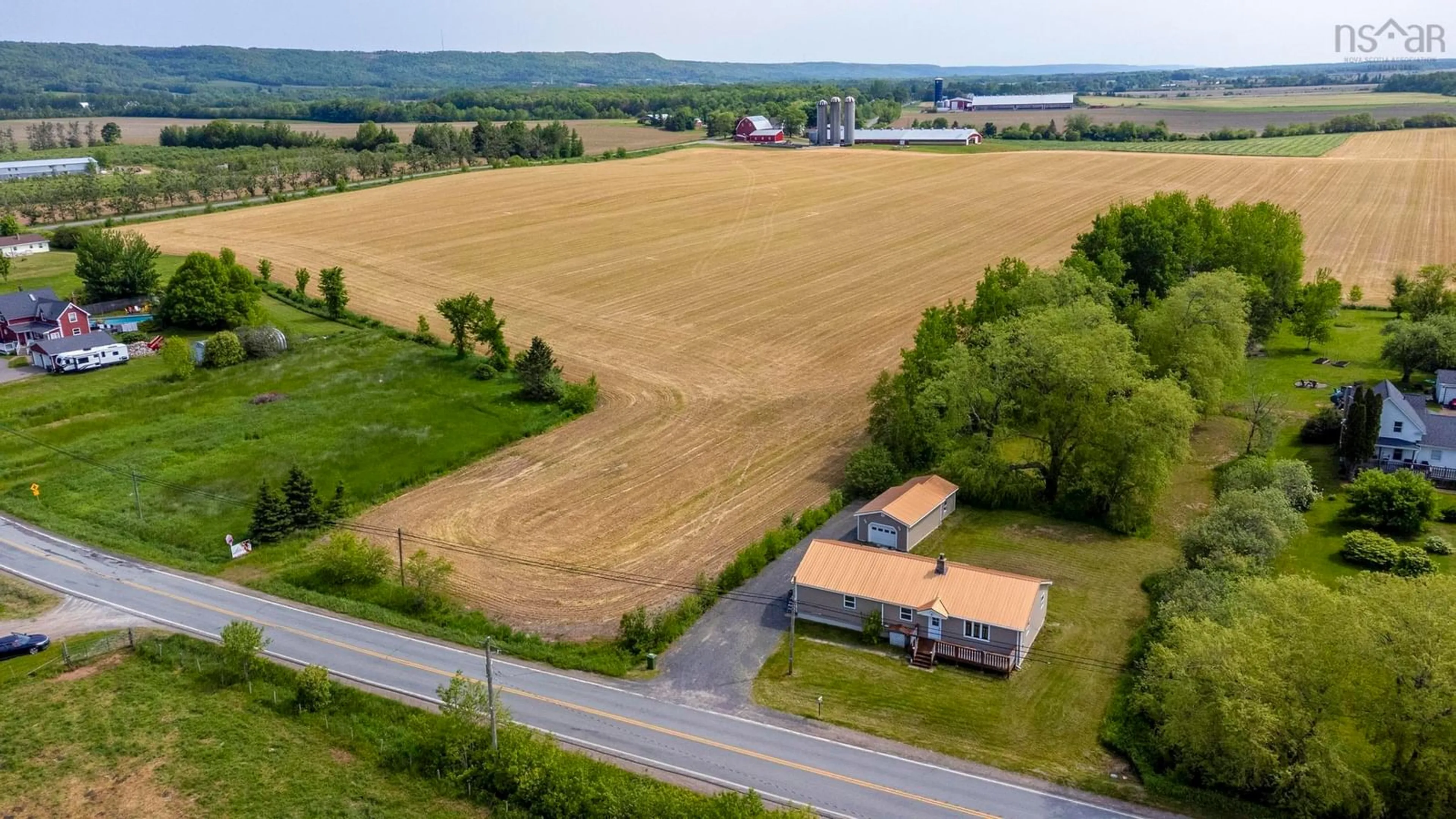 A pic from outside/outdoor area/front of a property/back of a property/a pic from drone, building for 1468 Victoria Road, Dempseys Corner Nova Scotia B0P 1C0