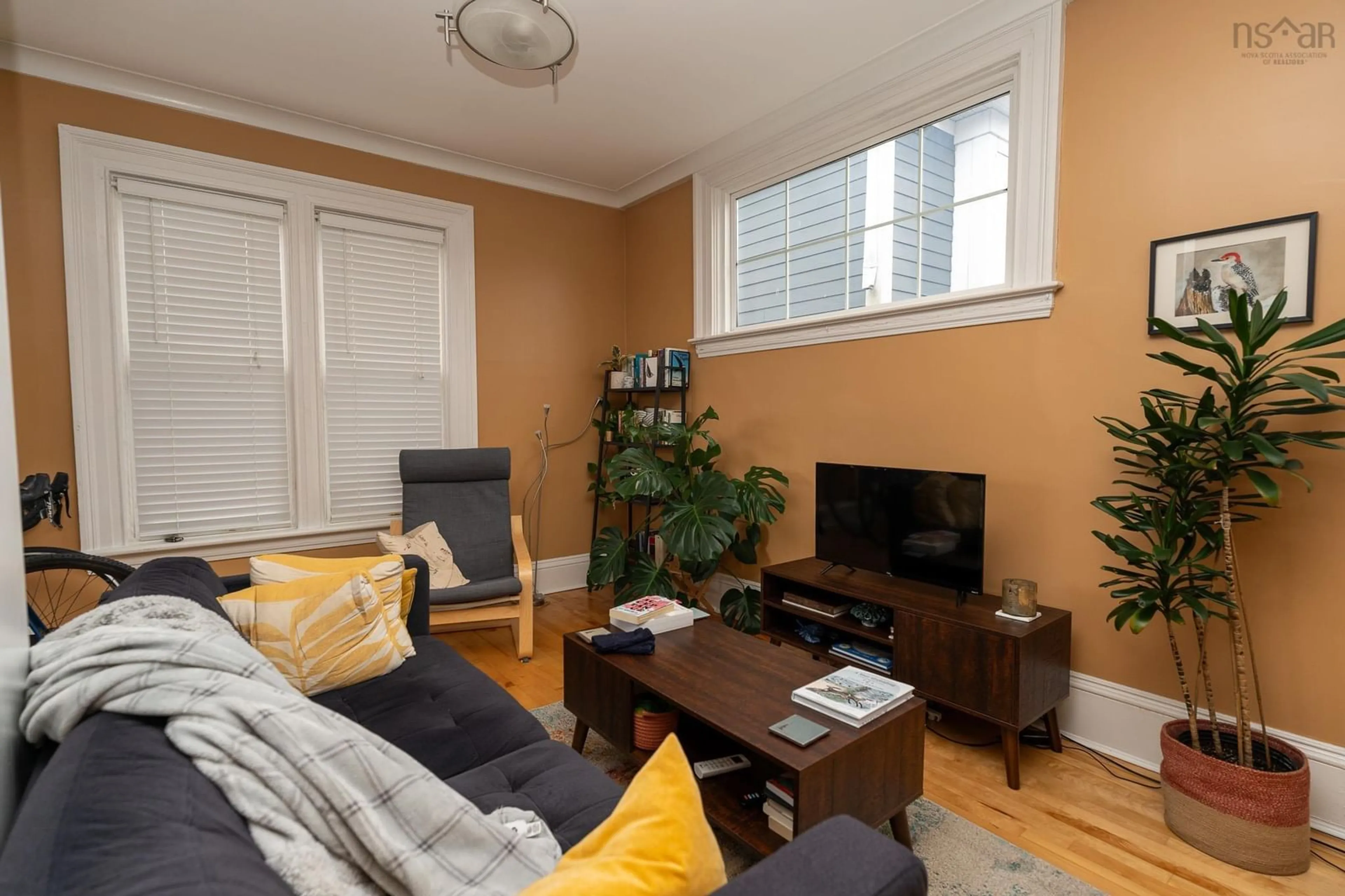 Living room with furniture, wood/laminate floor for 5626 Fenwick St, Halifax Nova Scotia B3H 1P8
