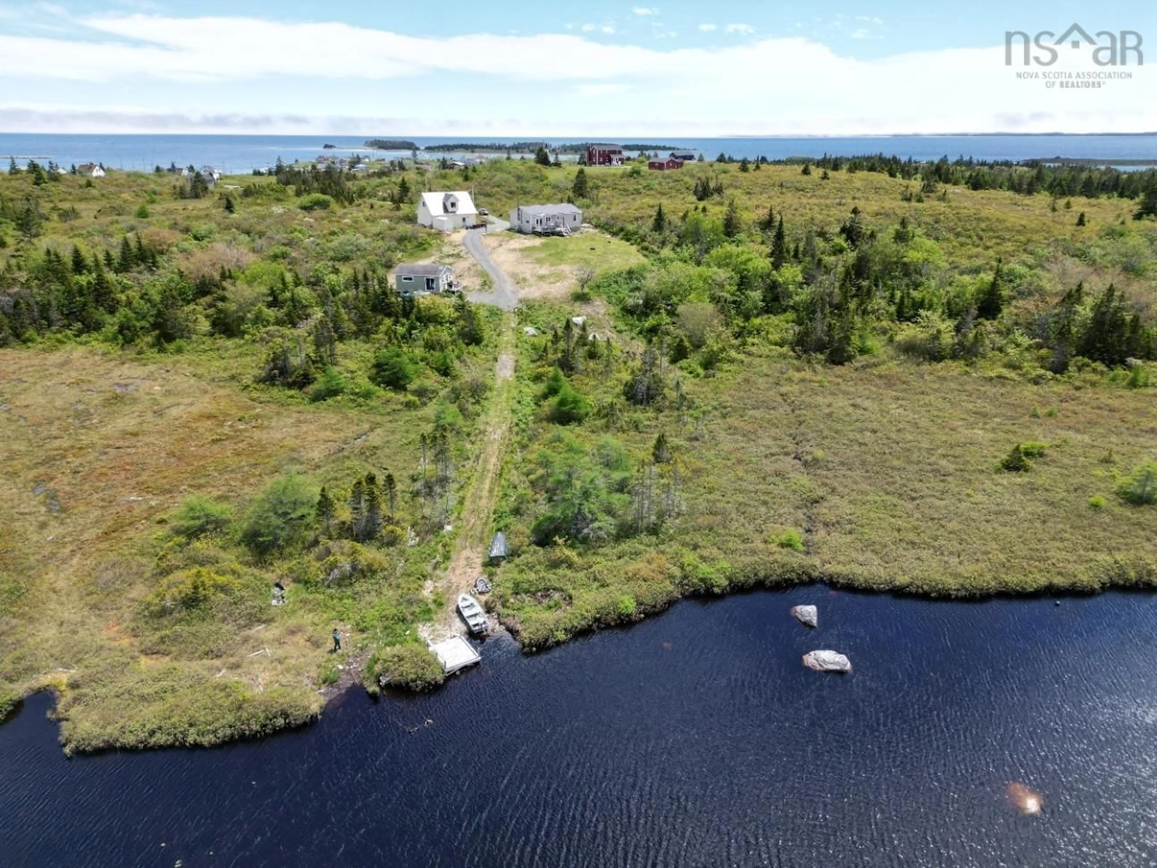 A pic from outside/outdoor area/front of a property/back of a property/a pic from drone, water/lake/river/ocean view for 50 North Rd, Charlos Cove Nova Scotia B0H 1T0