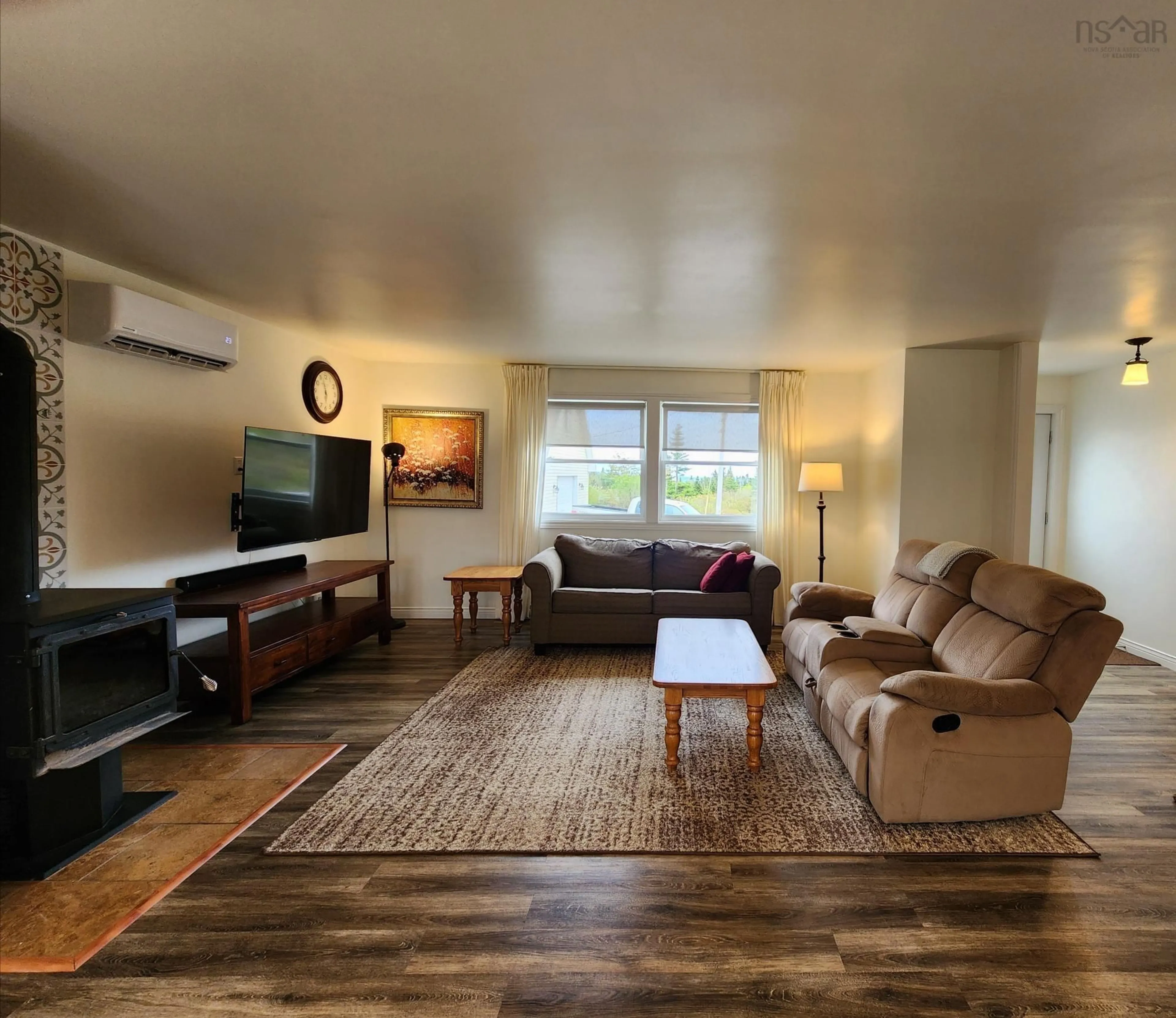Living room with furniture, wood/laminate floor for 50 North Rd, Charlos Cove Nova Scotia B0H 1T0