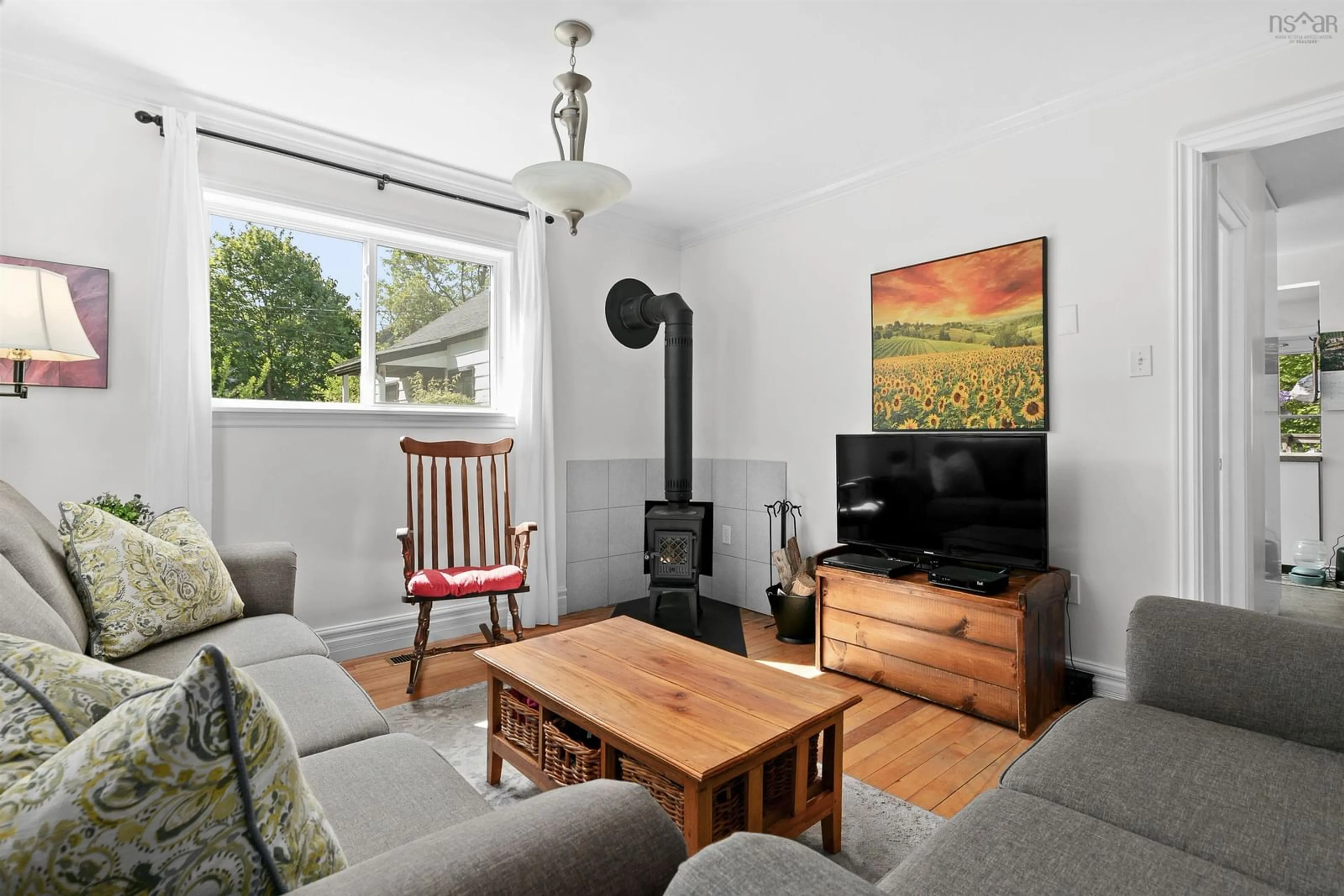 Living room with furniture, wood/laminate floor for 3030 Connolly St, Halifax Nova Scotia B3L 3N9
