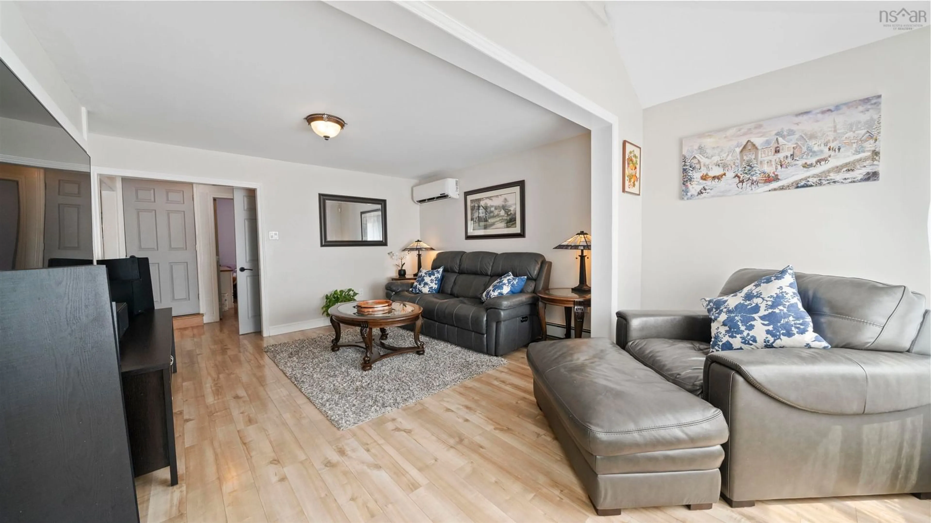 Living room with furniture, wood/laminate floor for 3419 Claremont St, Halifax Nova Scotia B3L 3L6