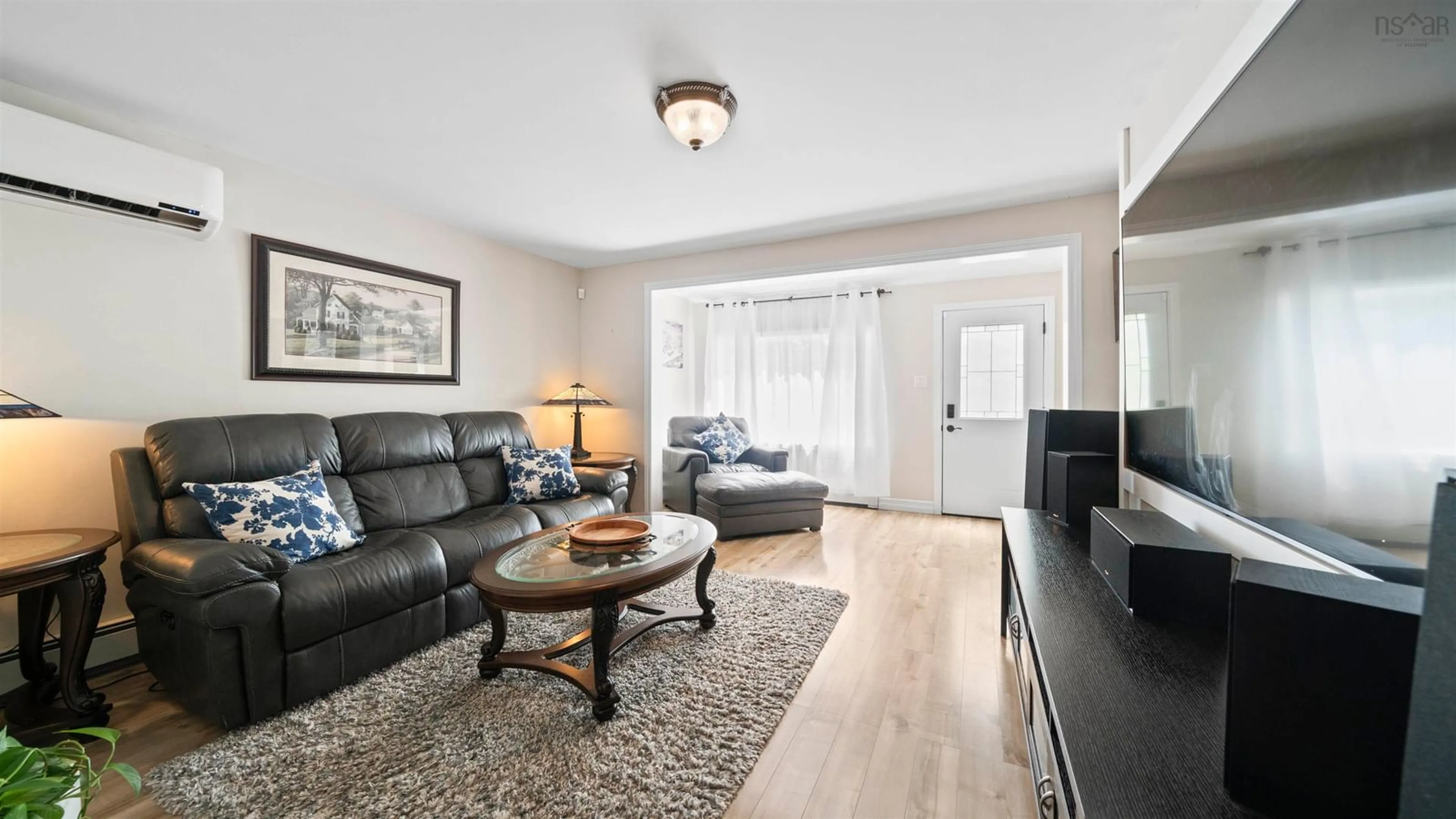 Living room with furniture, wood/laminate floor for 3419 Claremont St, Halifax Nova Scotia B3L 3L6
