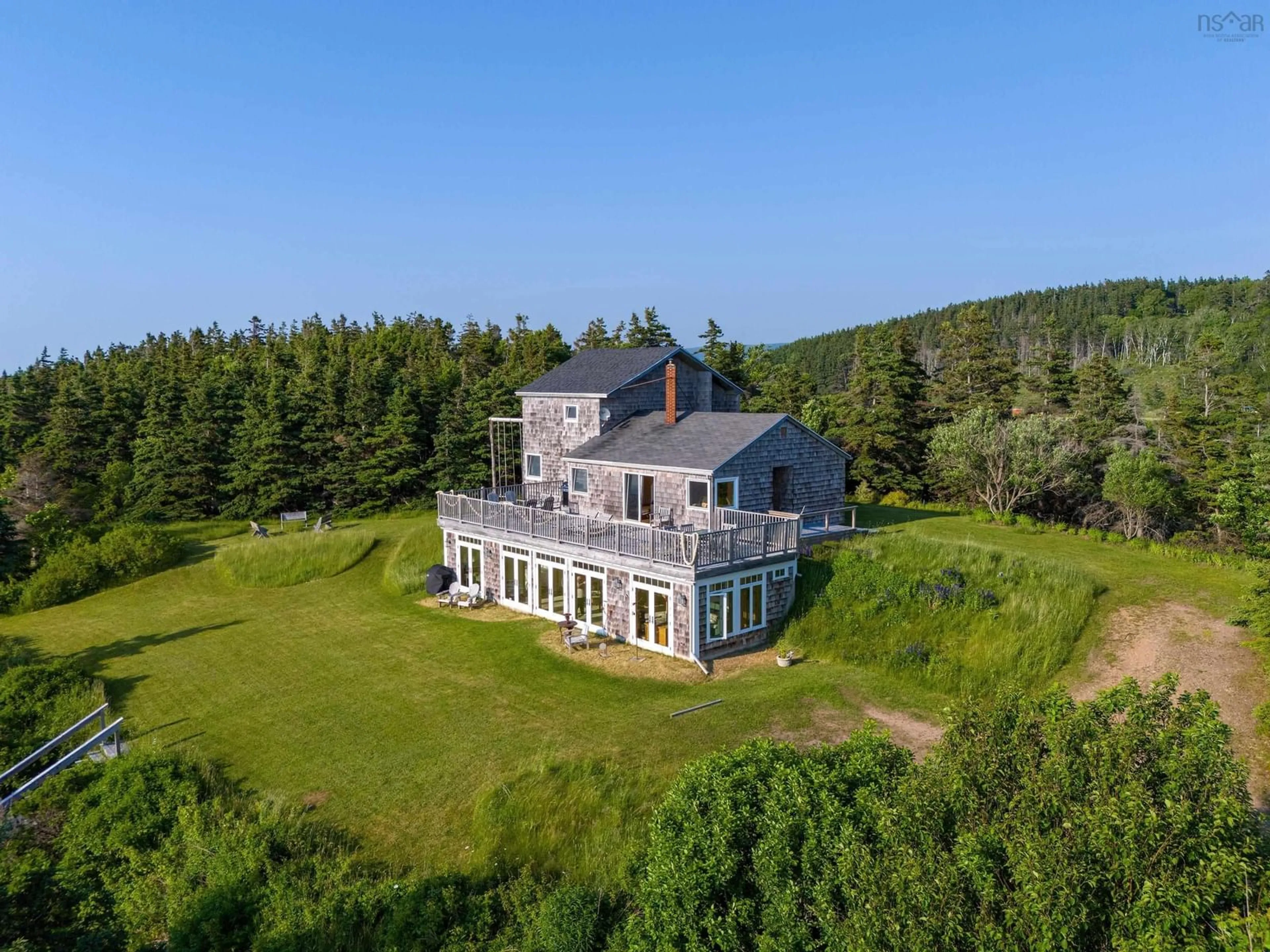A pic from outside/outdoor area/front of a property/back of a property/a pic from drone, water/lake/river/ocean view for 3589 Shore Rd, Margaree Harbour Nova Scotia B0E 2B0