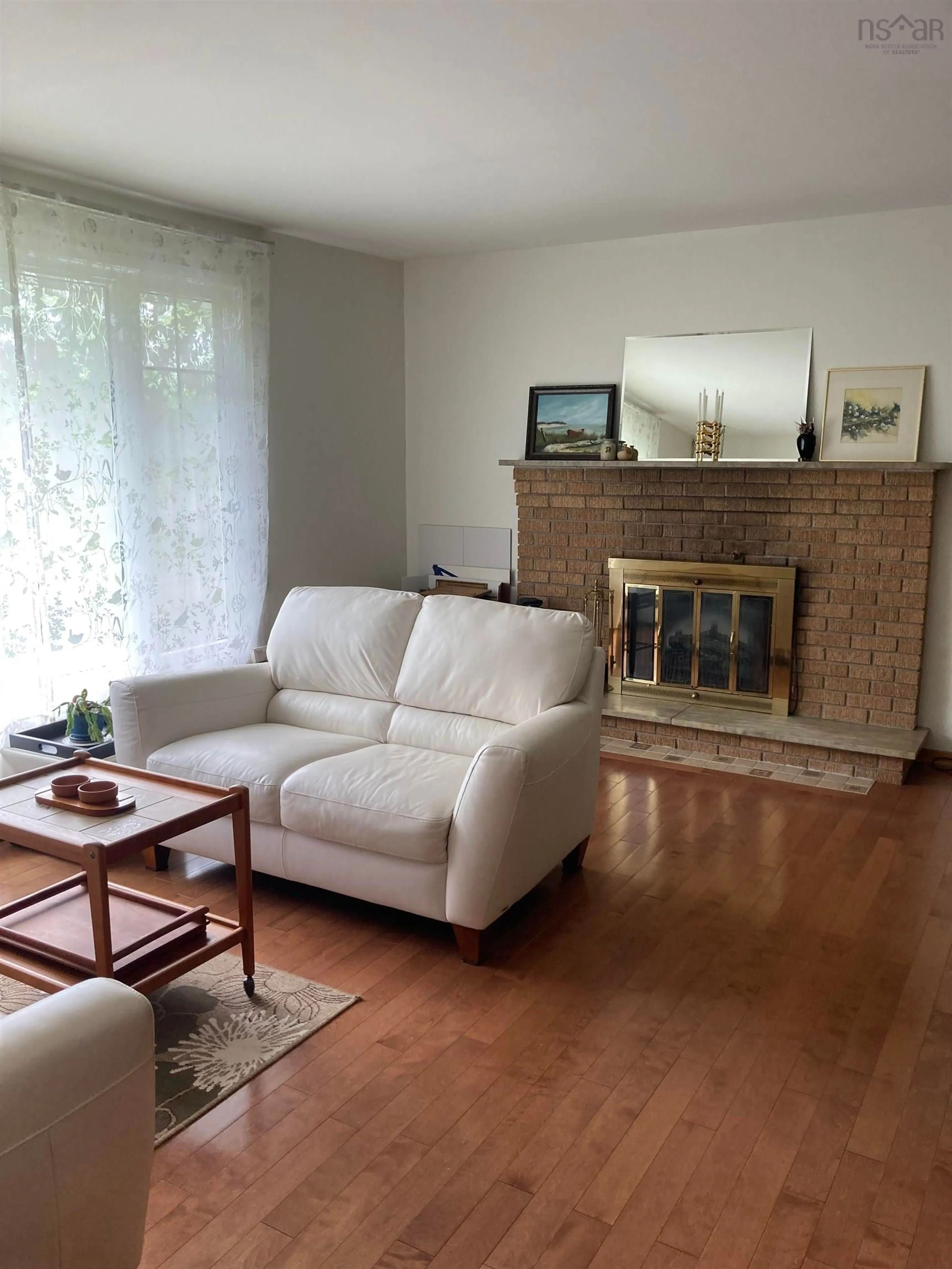 Living room with furniture, wood/laminate floor for 85 Pinetree Cres, Hammonds Plains Nova Scotia B3Z 1K4