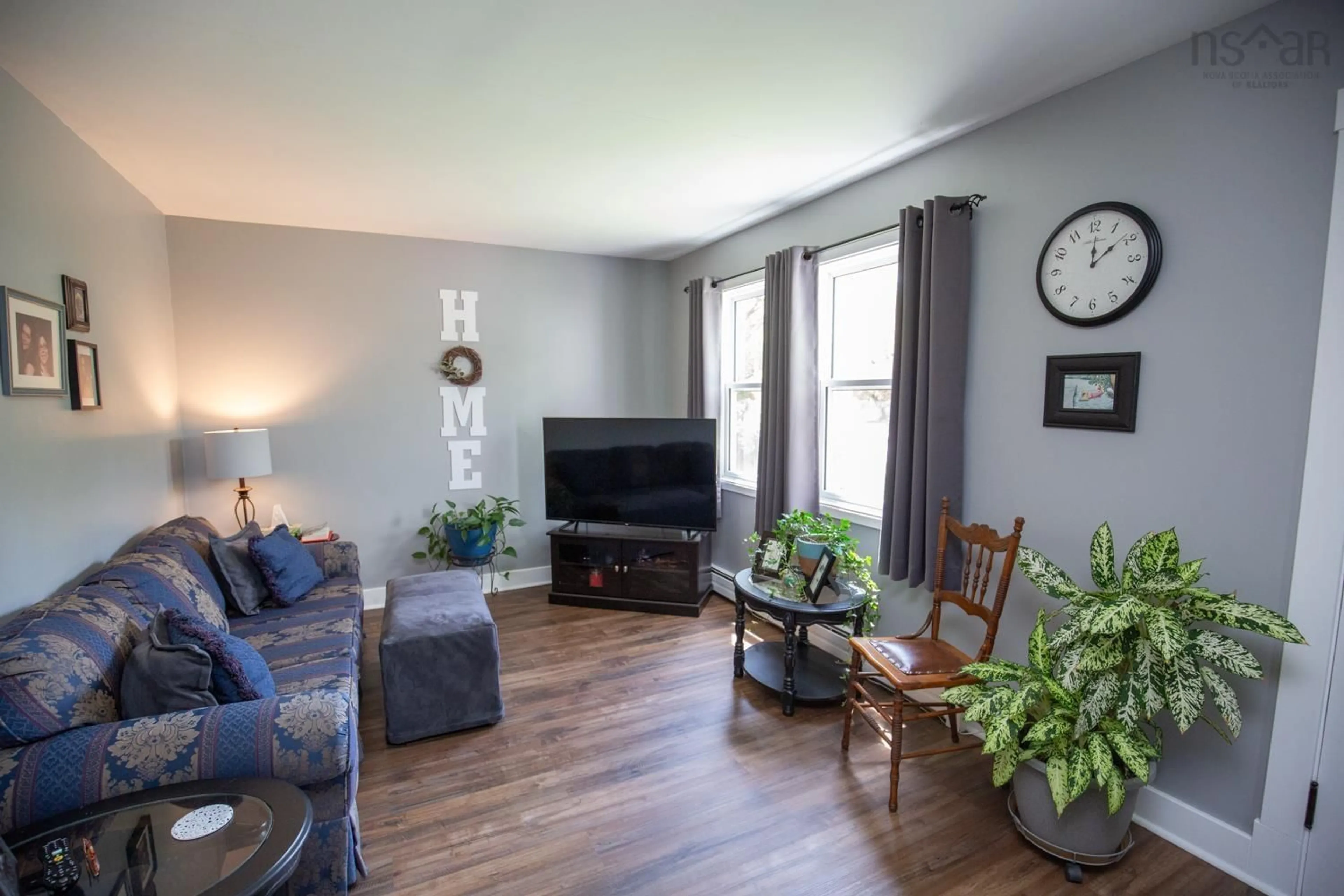 Living room with furniture, wood/laminate floor for 139 Greenfield Rd, Murray Siding Nova Scotia B6L 3M5