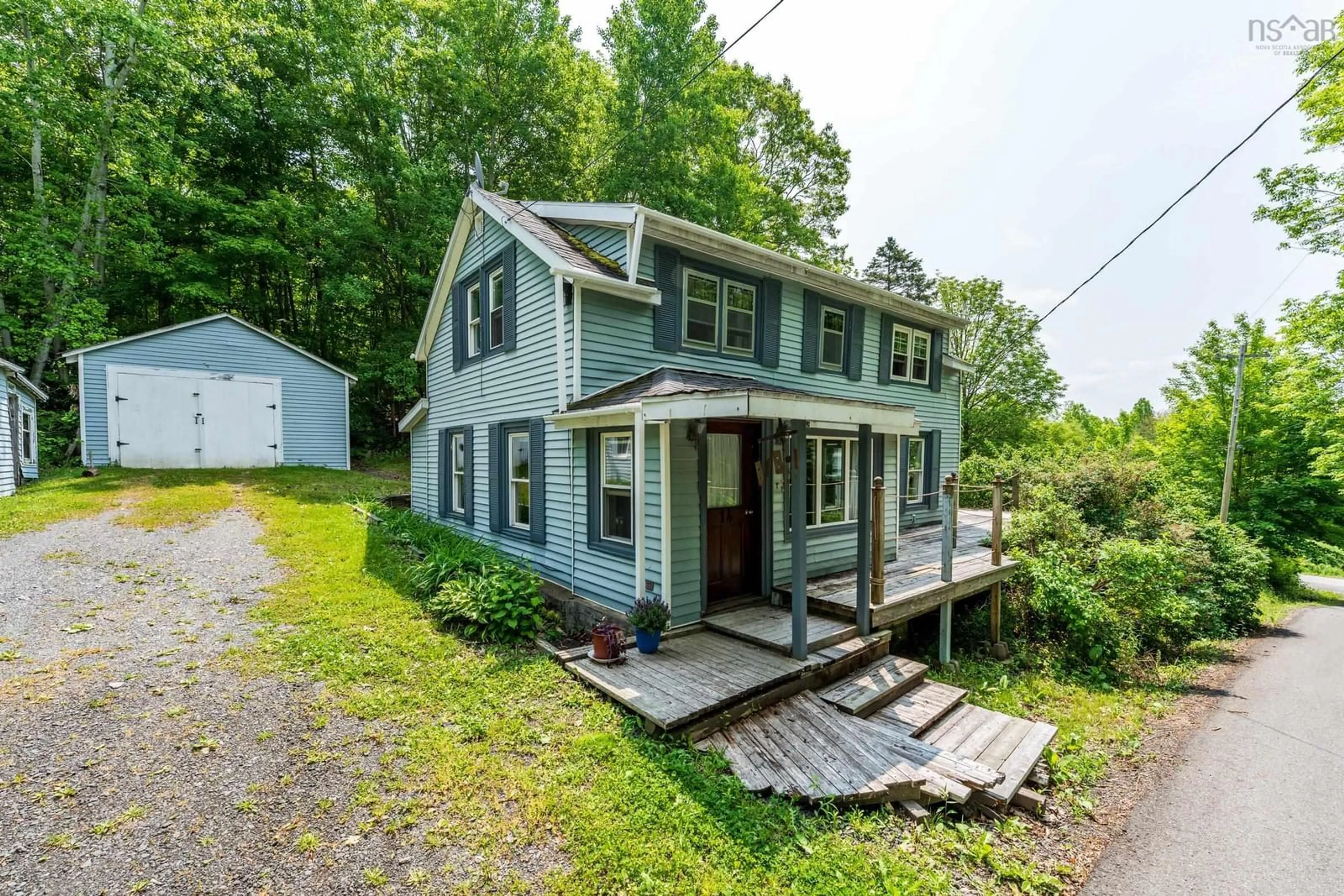 A pic from outside/outdoor area/front of a property/back of a property/a pic from drone, street for 14 Cross St, Bear River Nova Scotia B0S 1B0