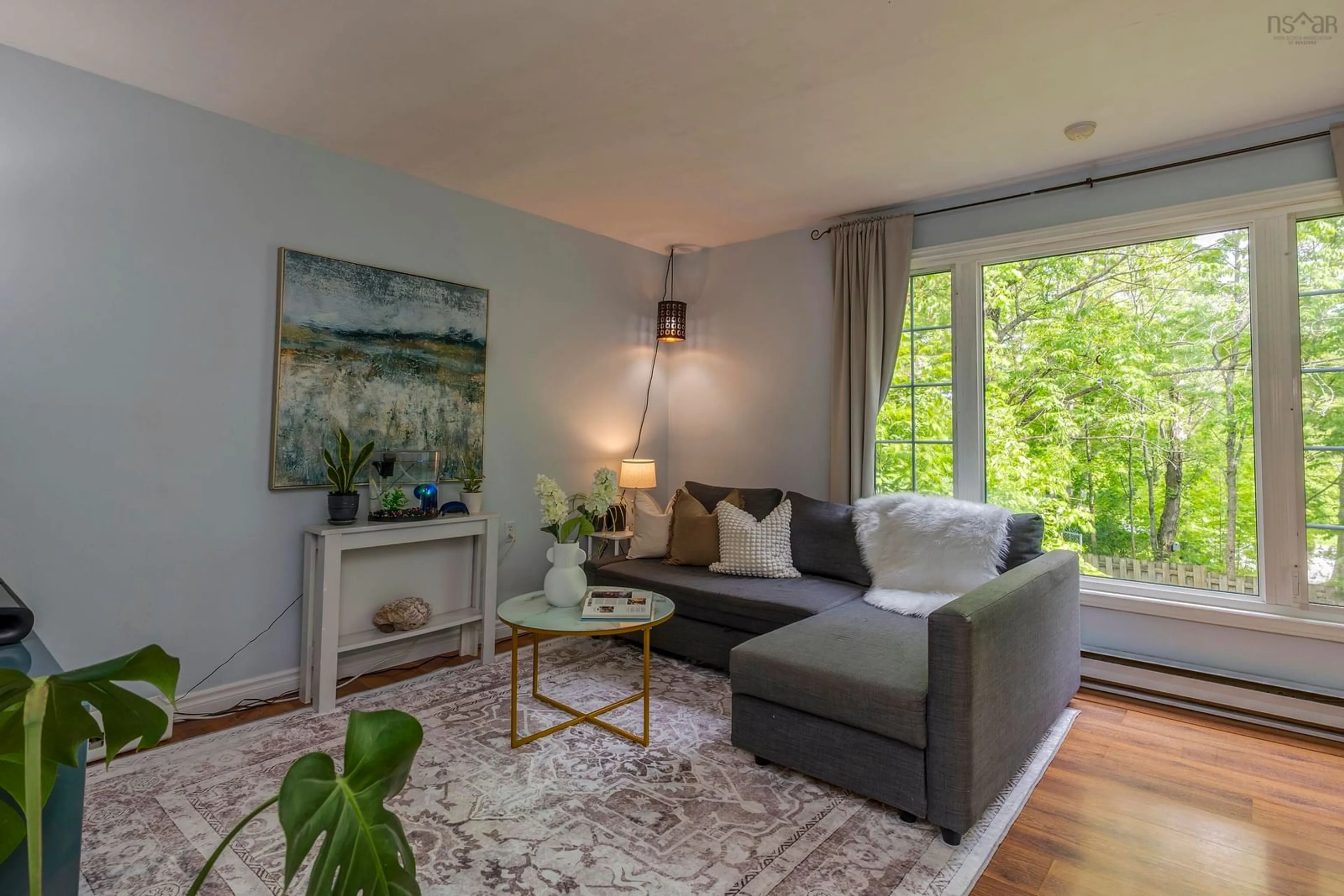Living room with furniture, wood/laminate floor for 5 Quaker Cres, Lower Sackville Nova Scotia B4C 2Z1