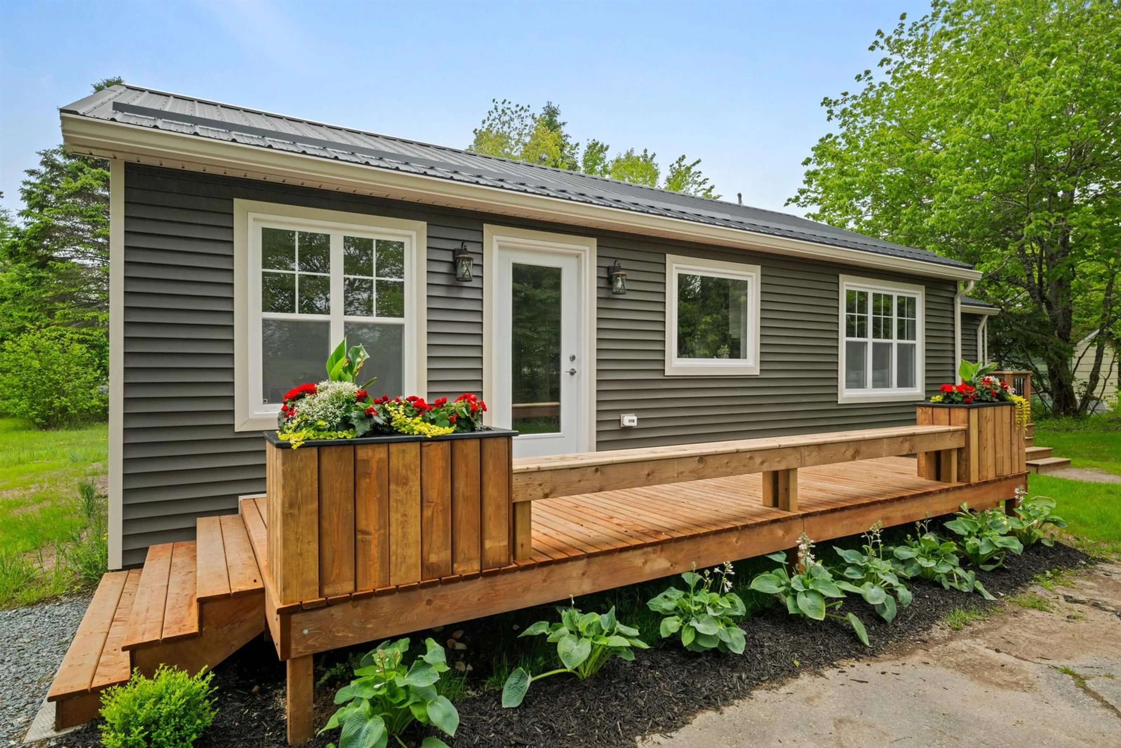 Home with vinyl exterior material, street for 7 Daylily Lane, Lake Charlotte Nova Scotia B0J 1L0