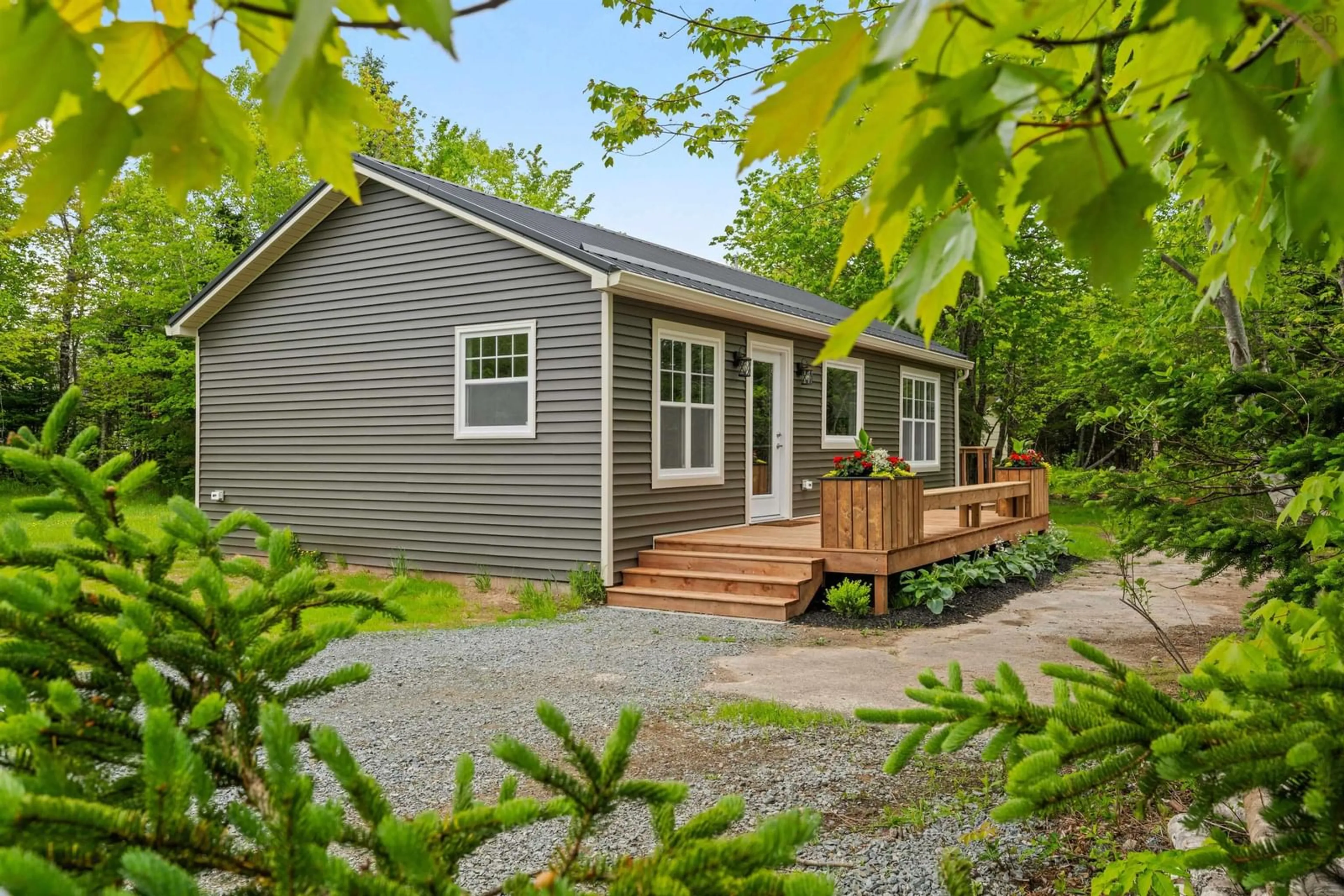 Home with vinyl exterior material, street for 7 Daylily Lane, Lake Charlotte Nova Scotia B0J 1L0