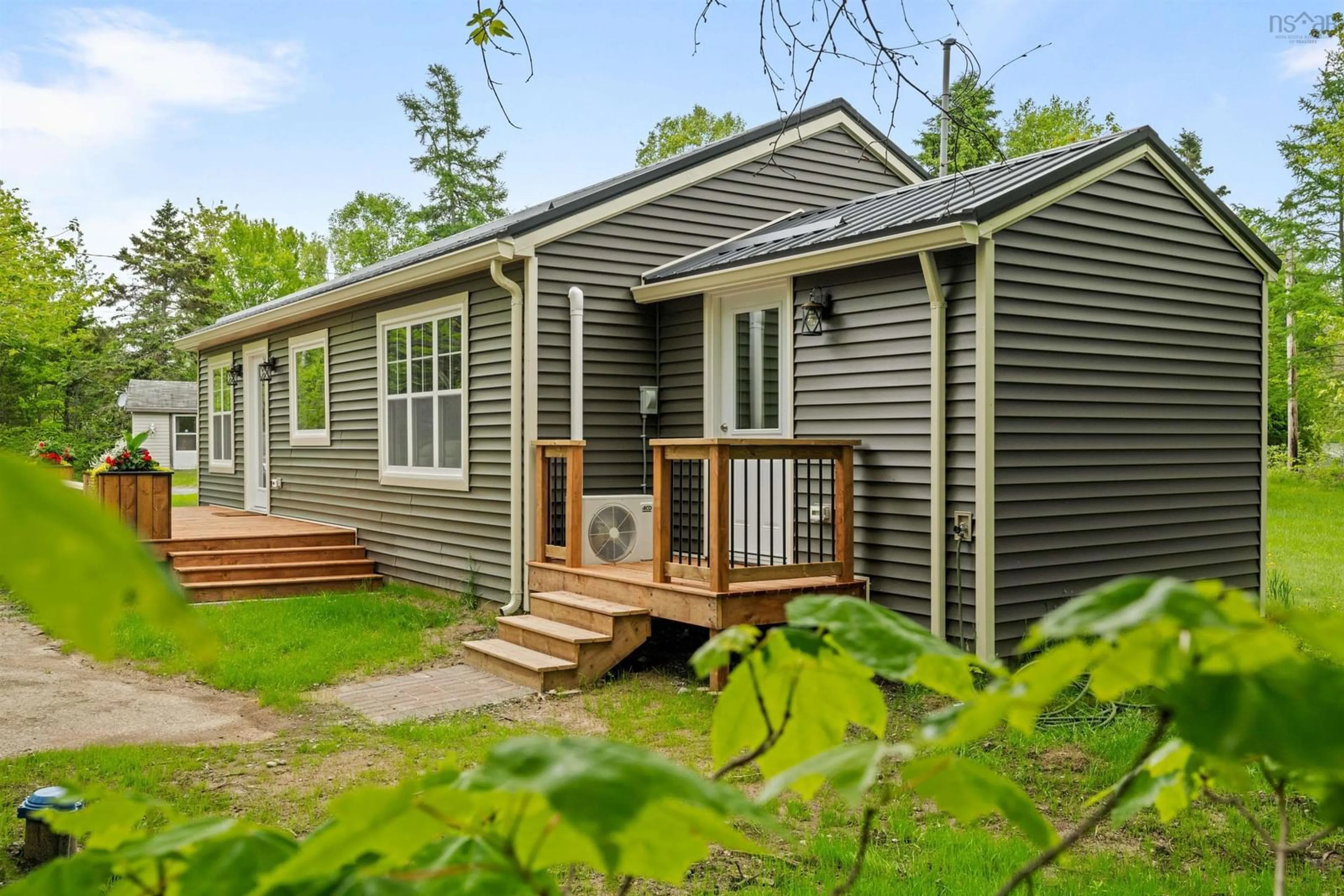 Home with vinyl exterior material, street for 7 Daylily Lane, Lake Charlotte Nova Scotia B0J 1L0