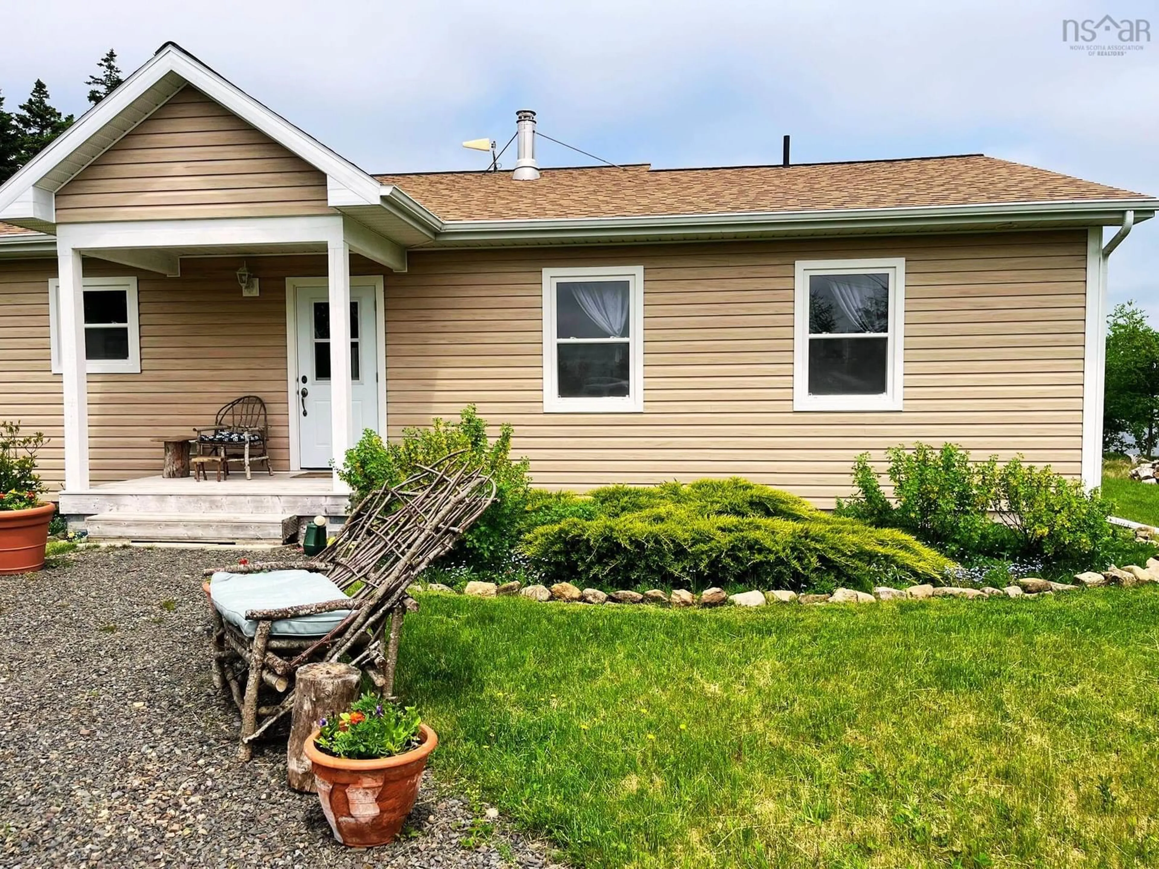 Home with vinyl exterior material, street for 1045 North Side Loch Lomond Rd, Loch Lomond Nova Scotia B2E 1C4